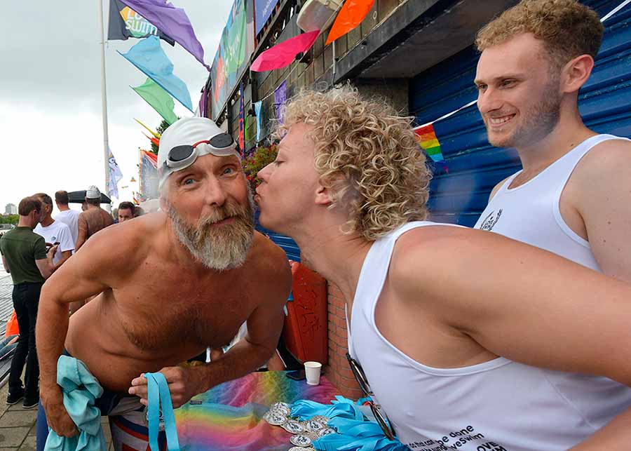 Two people stretching on yoga mats