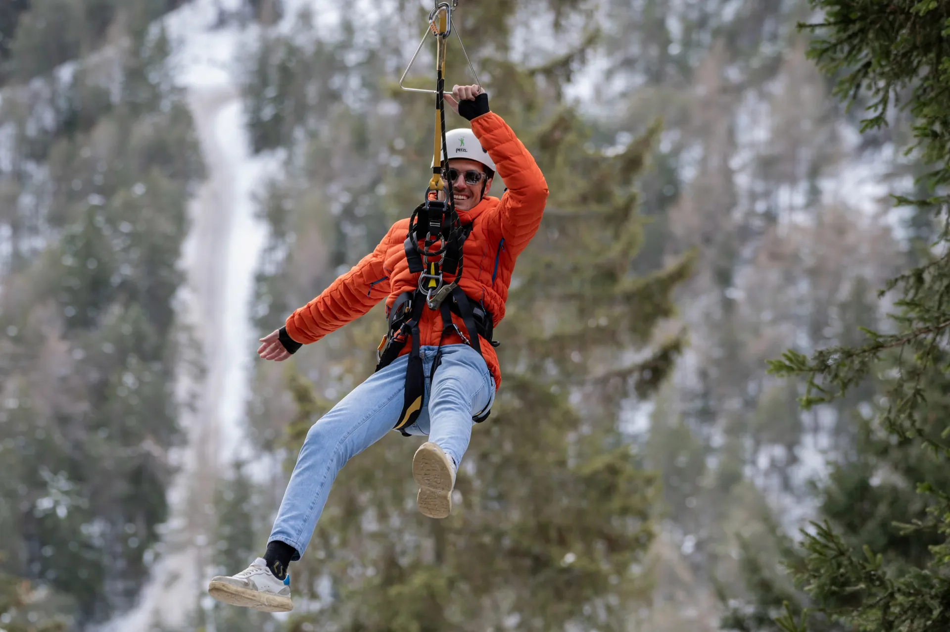 Winter zip line through the snowy woods