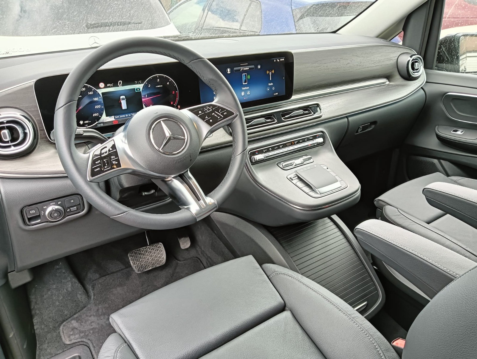 greyscale photo of classic vehicle on ground
