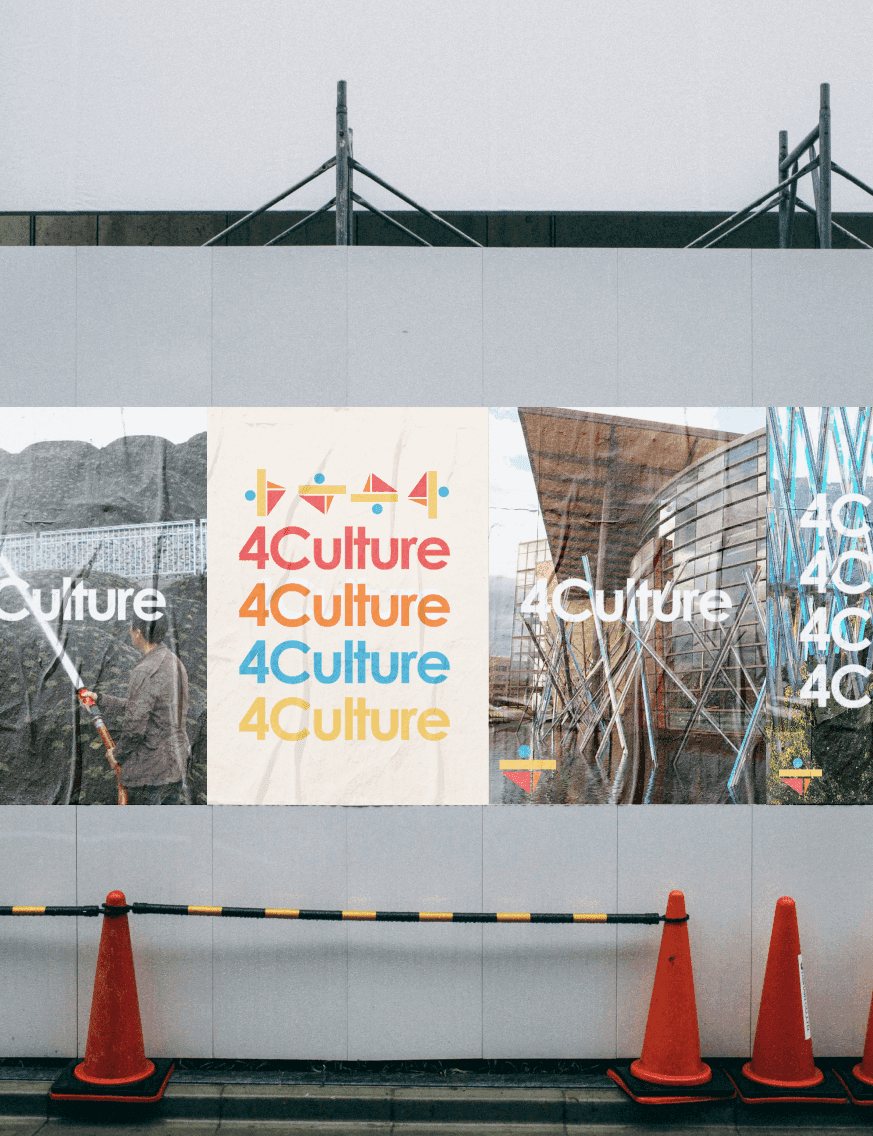 A grey wall displaying 4 posters with the 4Culture logo
