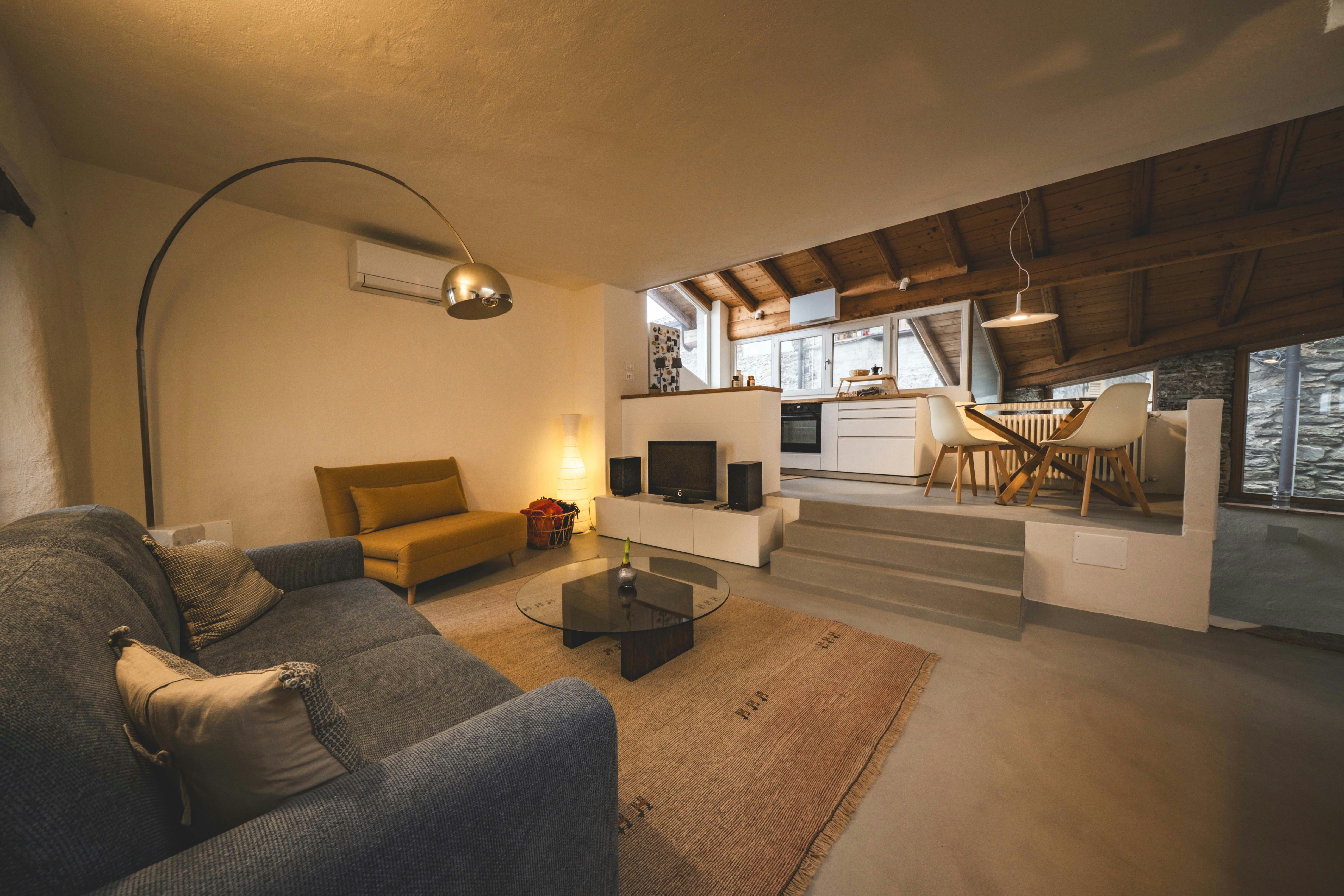 A living room filled with furniture and a fire place