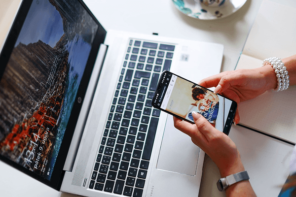 Reviewing Shopify product content and mobile experience on laptop and smartphone