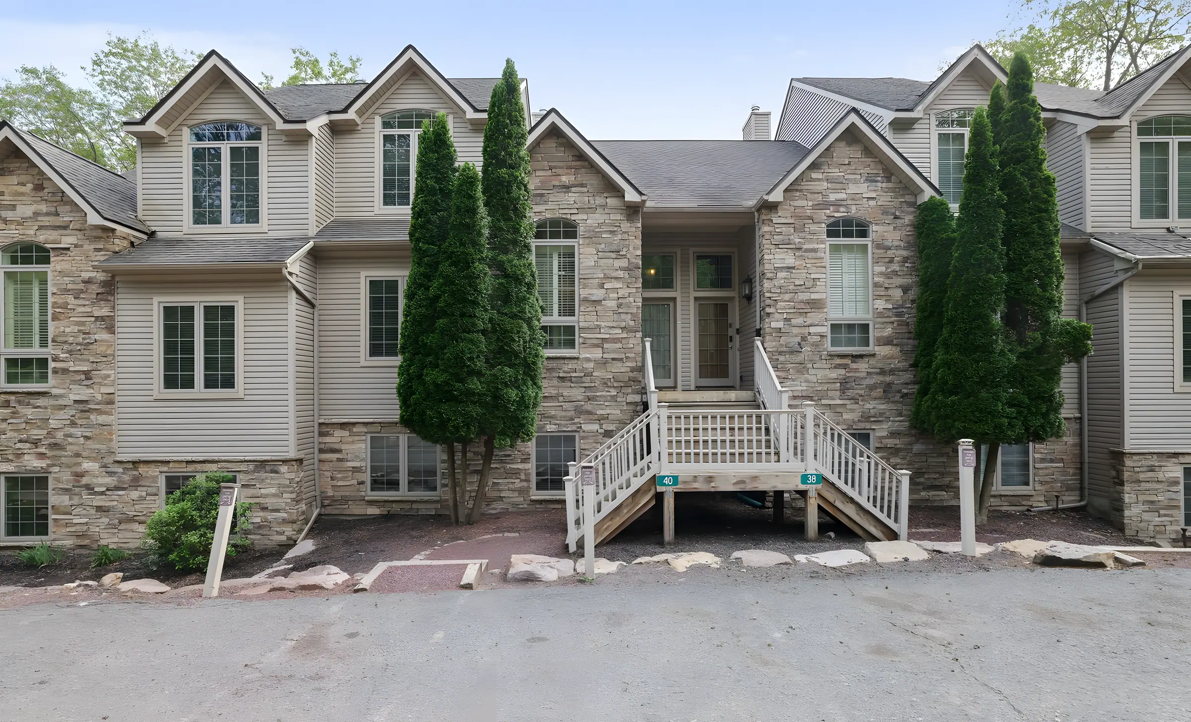 Stone and siding townhome row with front stairs at Pop's Place, Big Boulder, Lake Harmony, PA