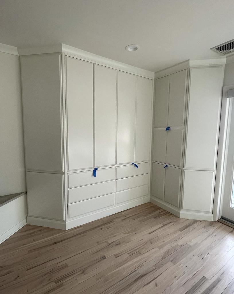 Built in cabinetry and paneled wall in a renovated mudroom