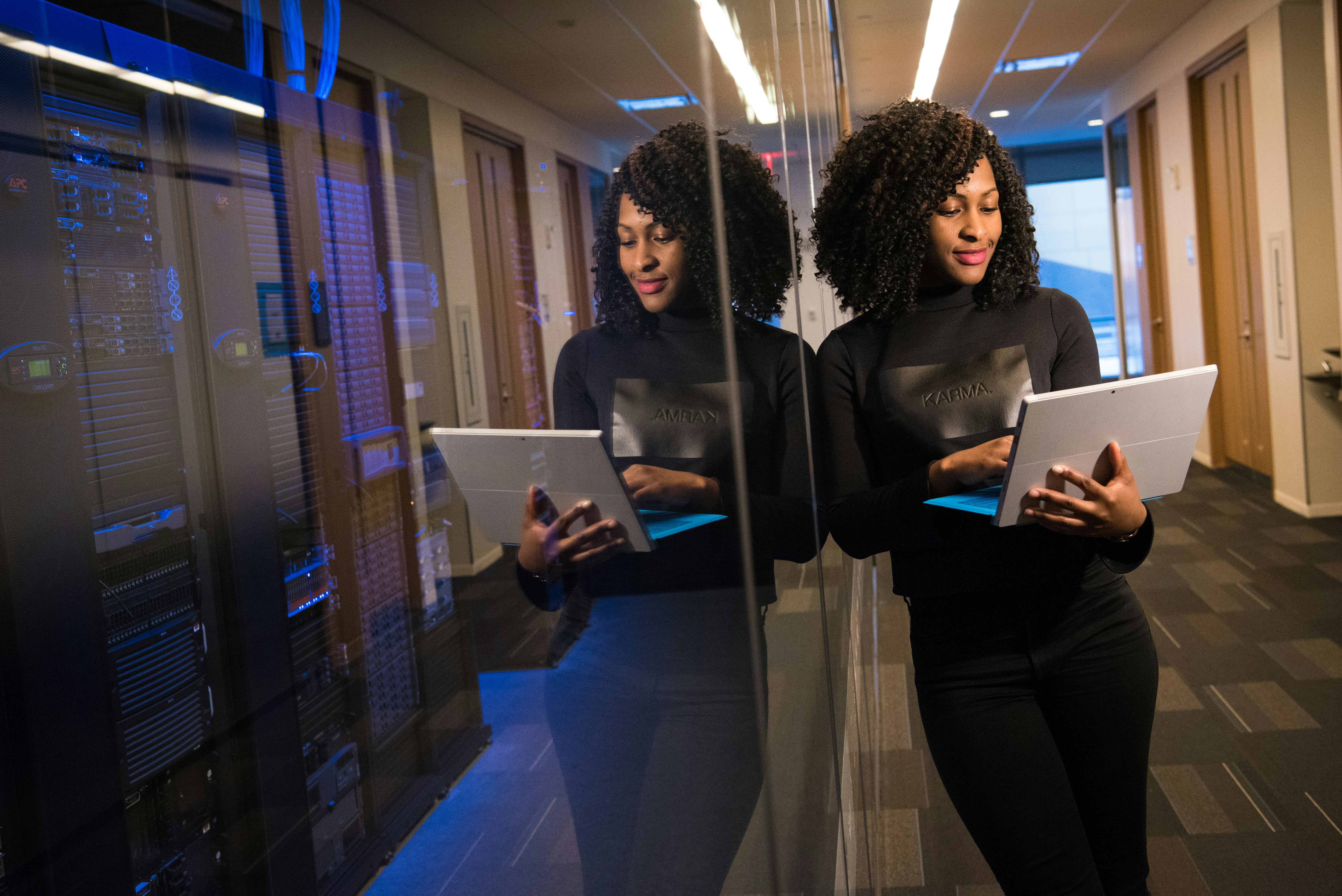 woman infront of server room - AI Services for Business