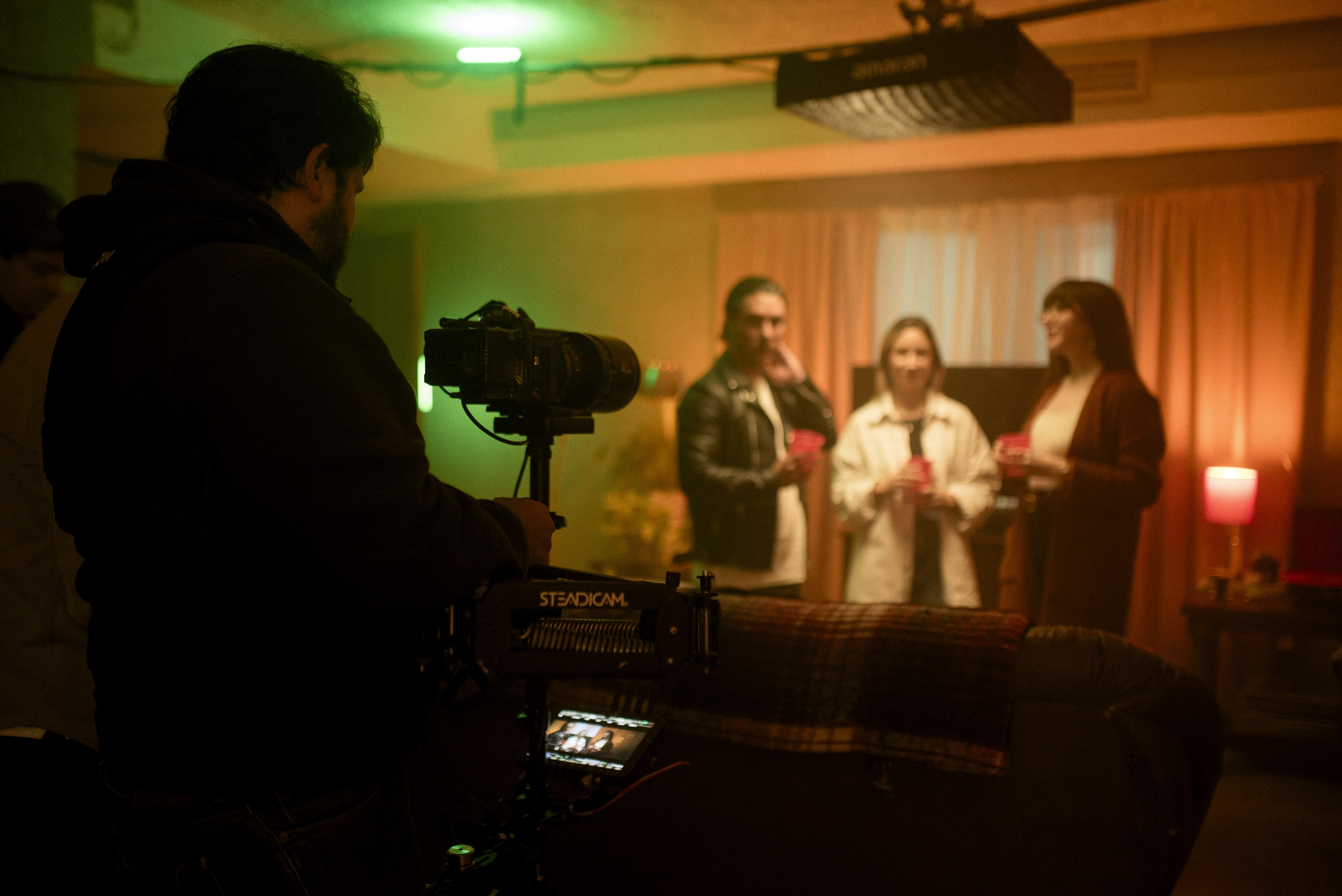 ollaborative production team of Antimateria Films on set for a global Warner Music project, highlighting film production services.