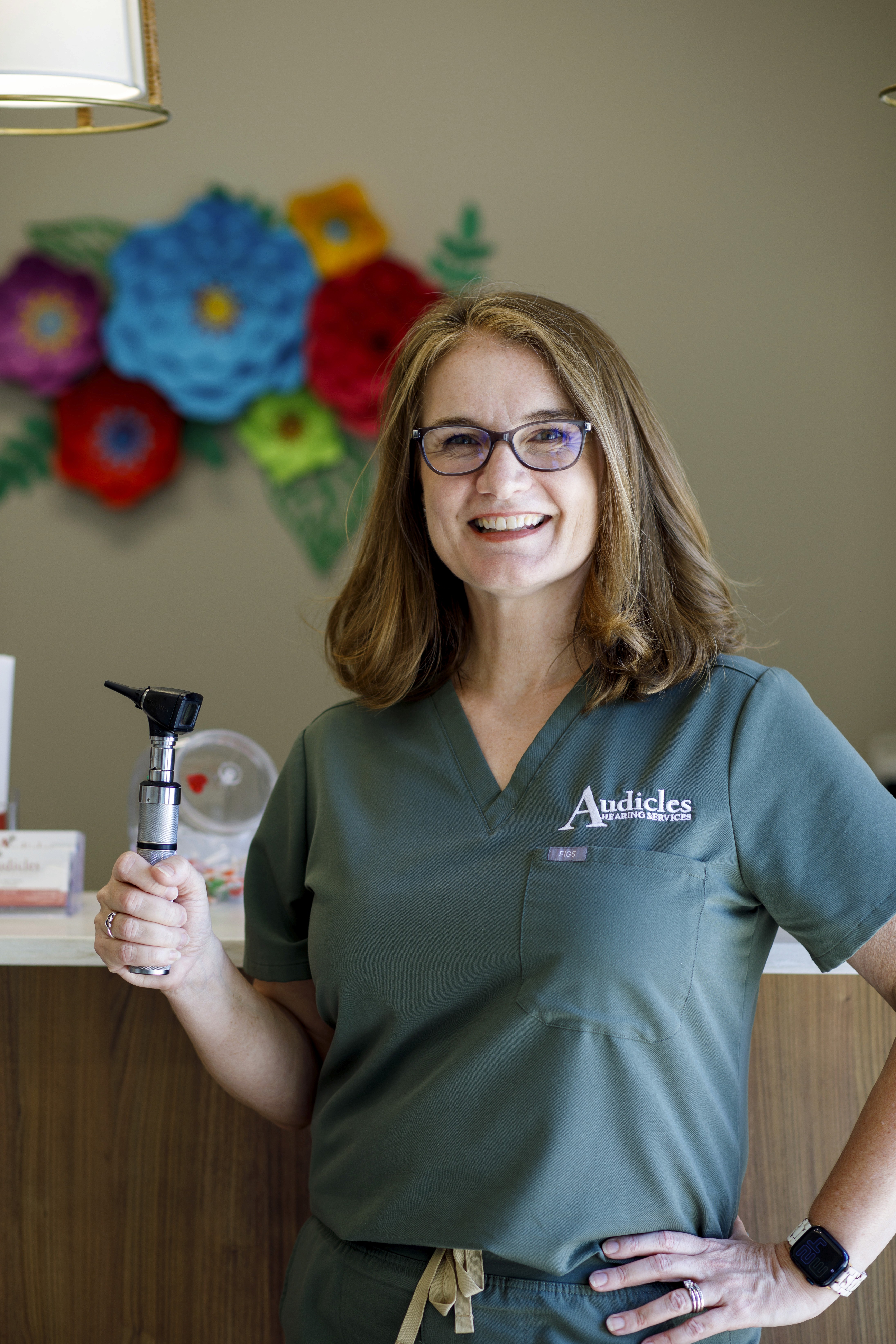 Dr Tracy Board with an otoscope