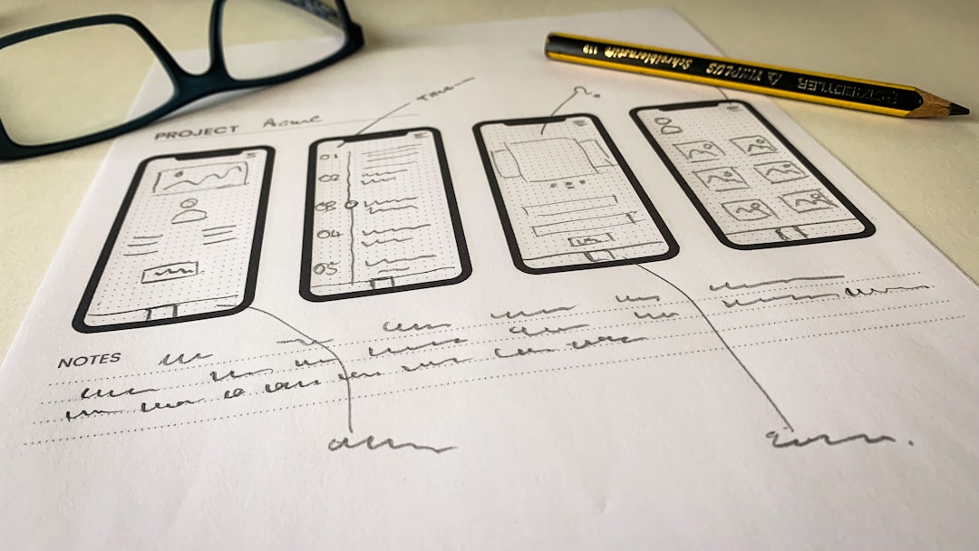 designer reviewing mobile app wireframes