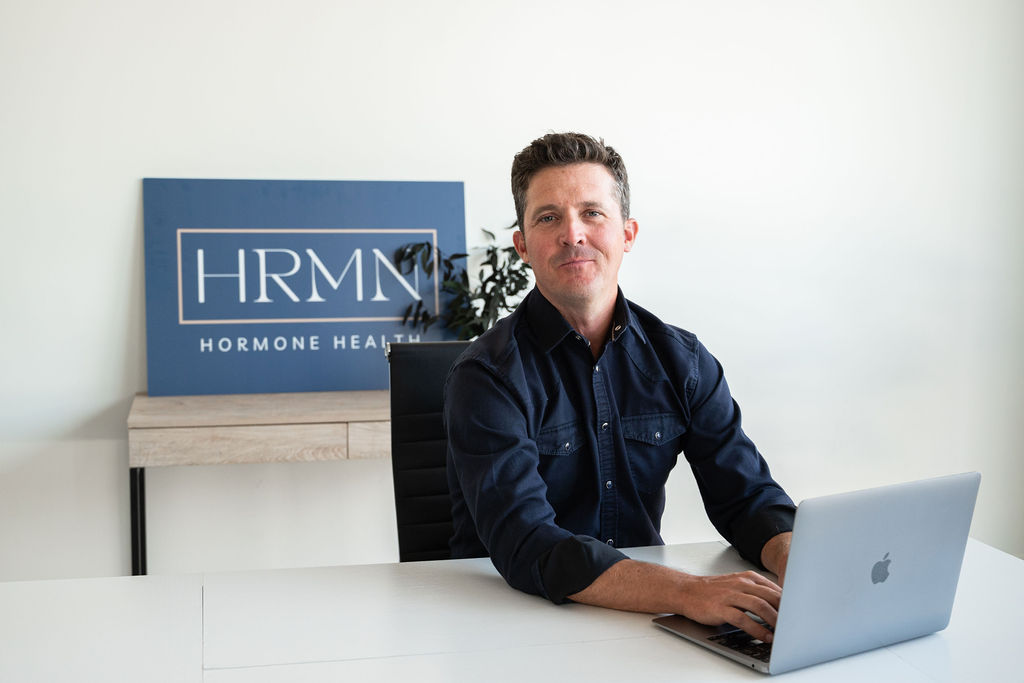 Jamie Ruiz and Chelsey Galipeau seated together in a cozy and modern office space, smiling warmly and creating a welcoming atmosphere