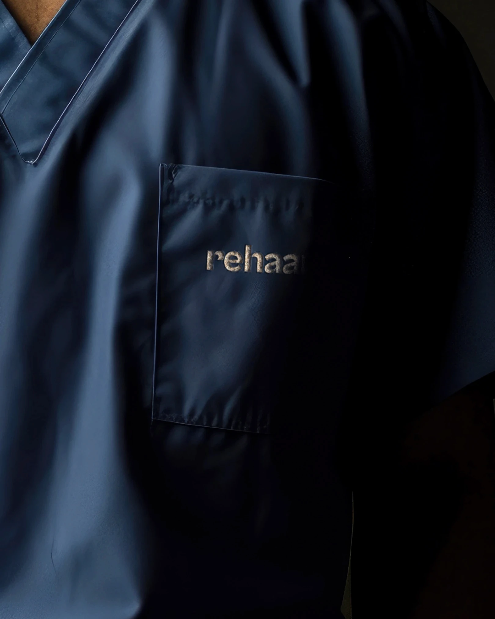 Blue scrubs with logo