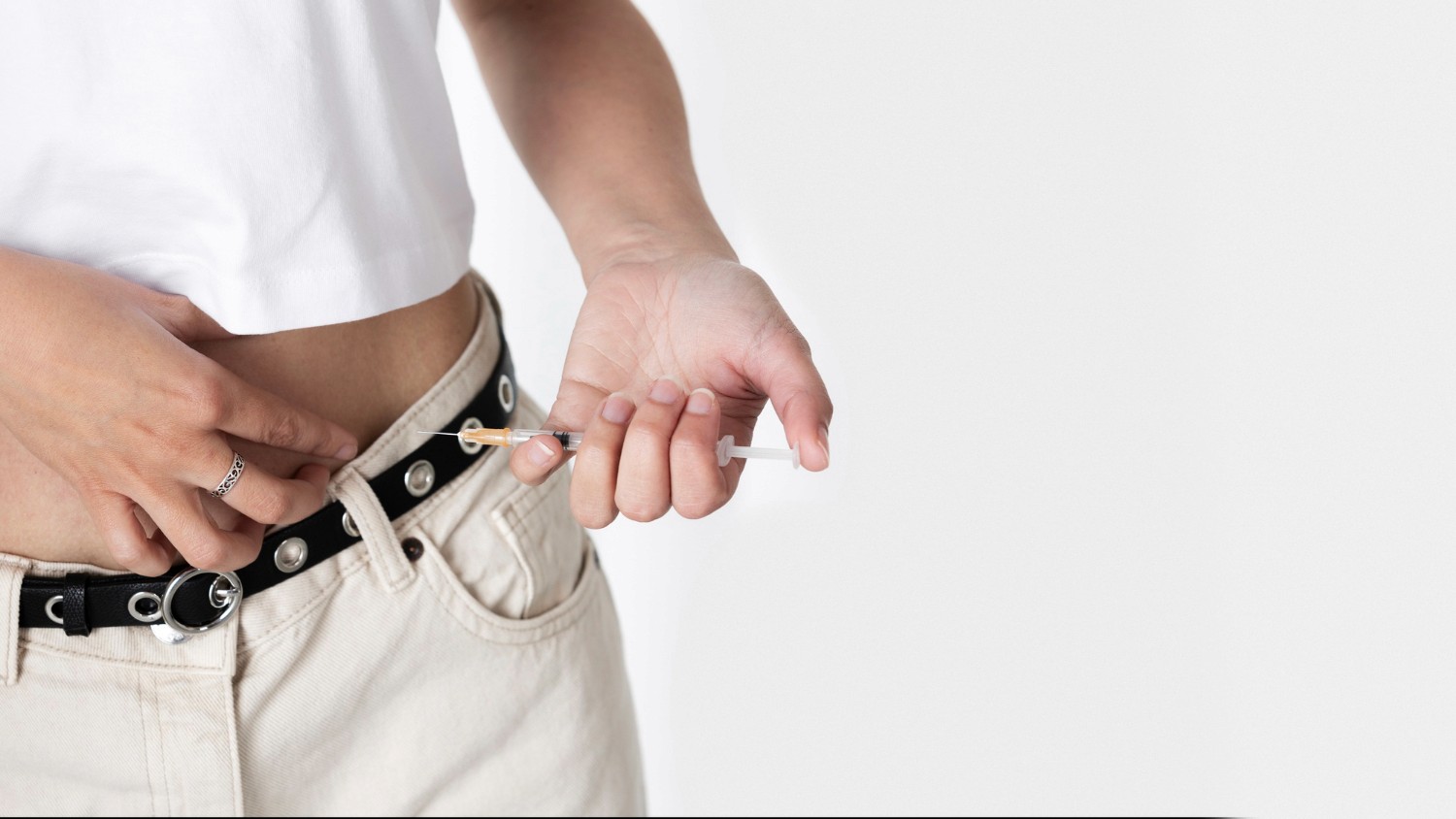 woman measuring waistline