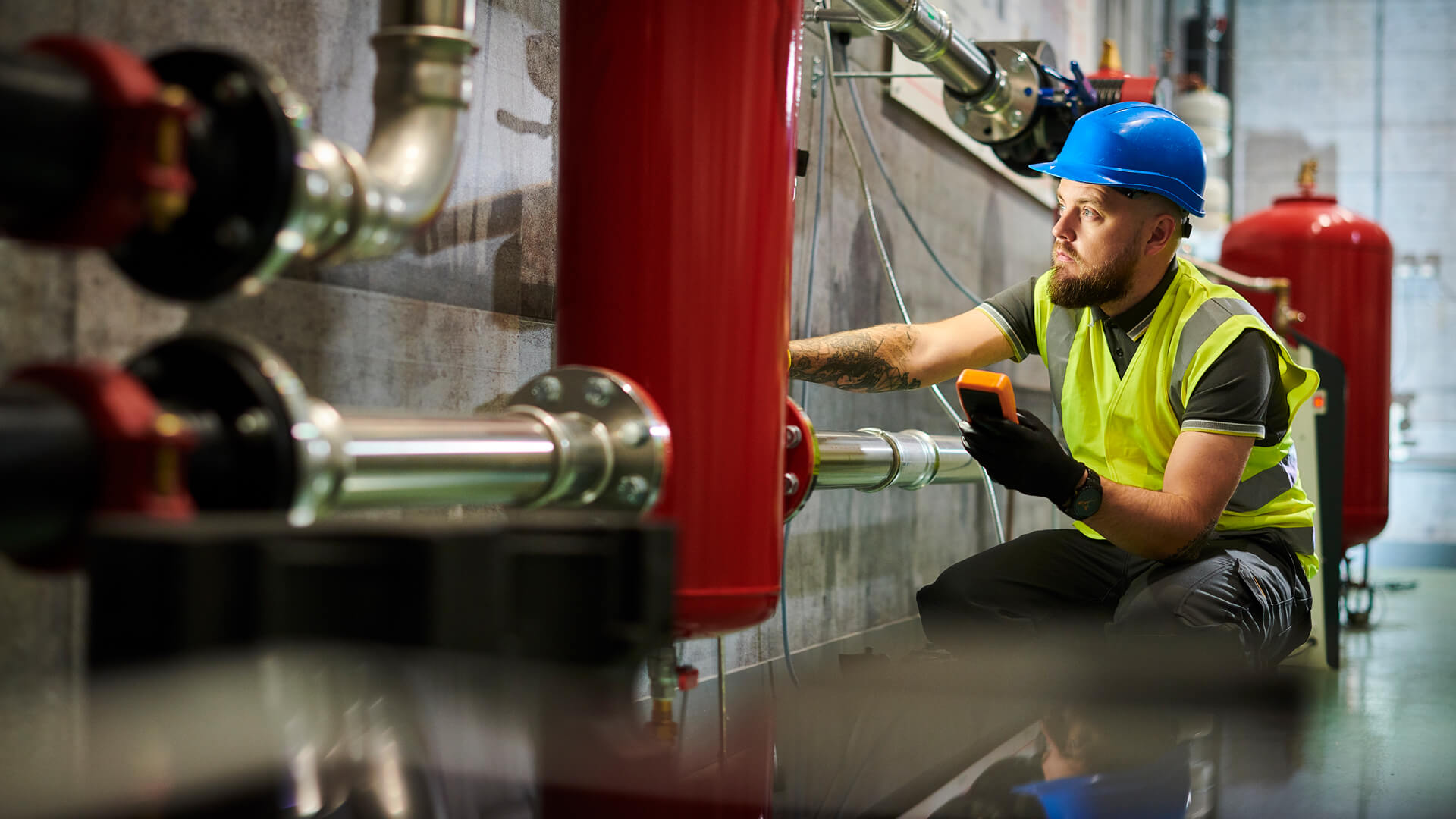 man in black jacket sitting on black chair