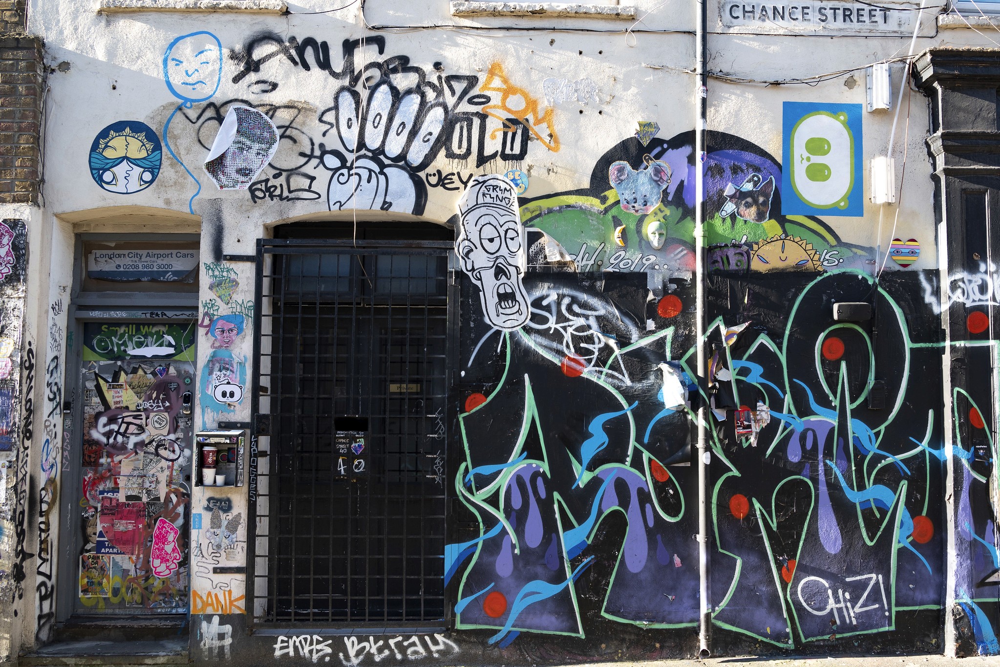 A graffiti covered wall outside the Maison Gainsbourg in Paris. 