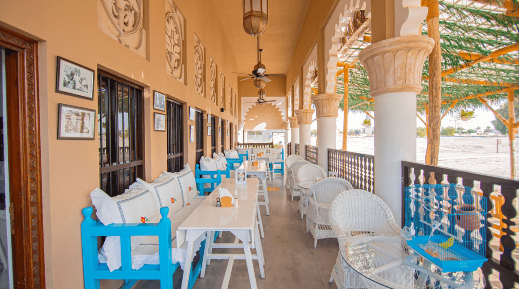 Arabian Tea House featuring casual white and blue seating with clean and simple white tables.