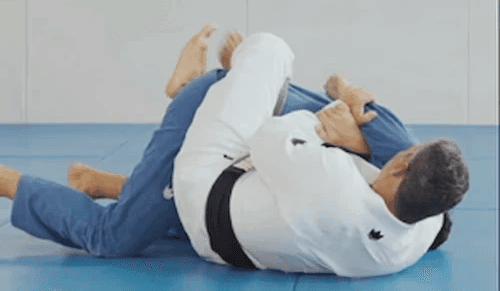 Advance Jiu Jitsu patches and belt laid on the mat
