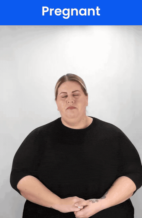 Animated GIF: a Deaf signer signs PREGNANT in ASL, an open hand moving out from the stomach.