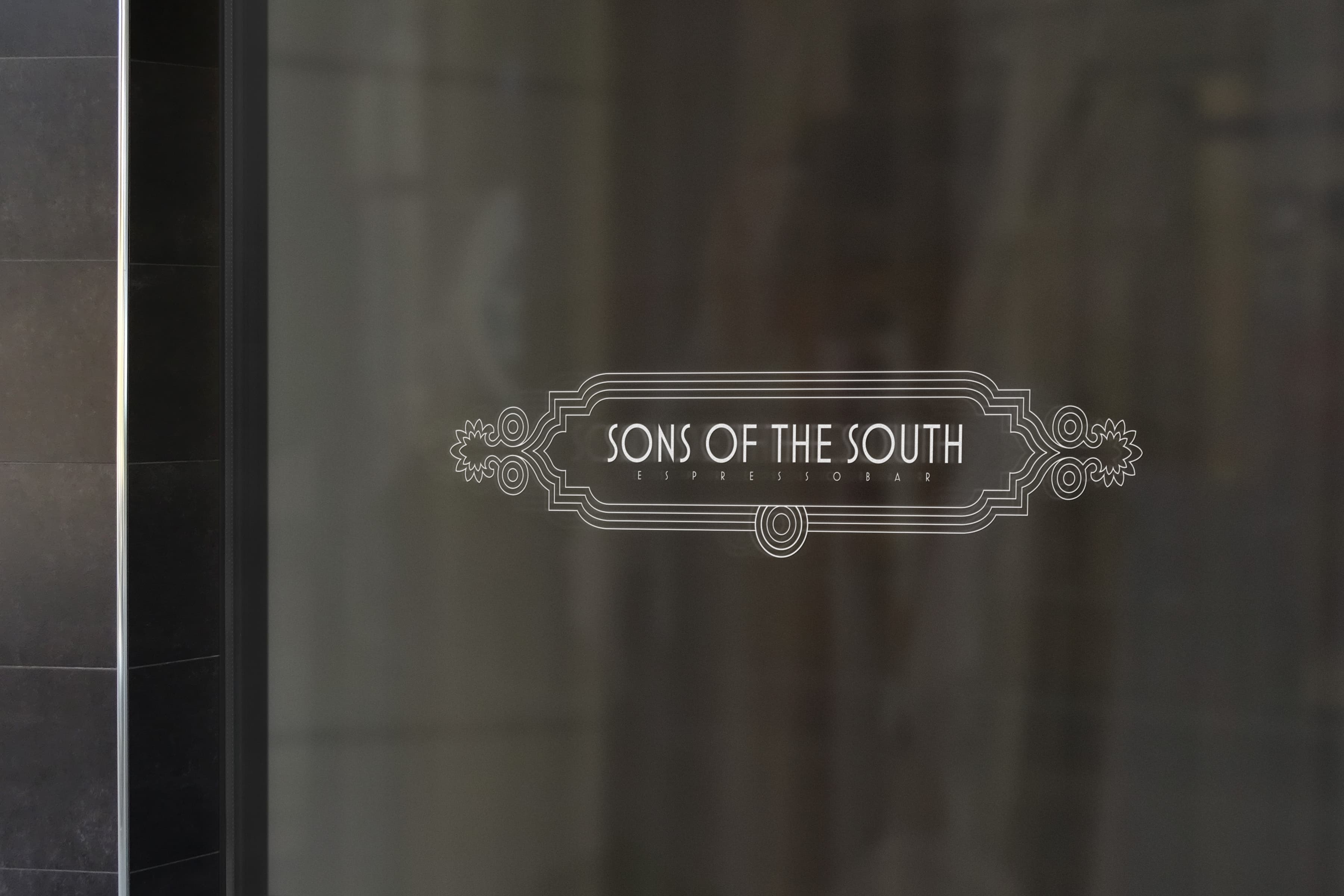 Sons of the South logo on restaurant window