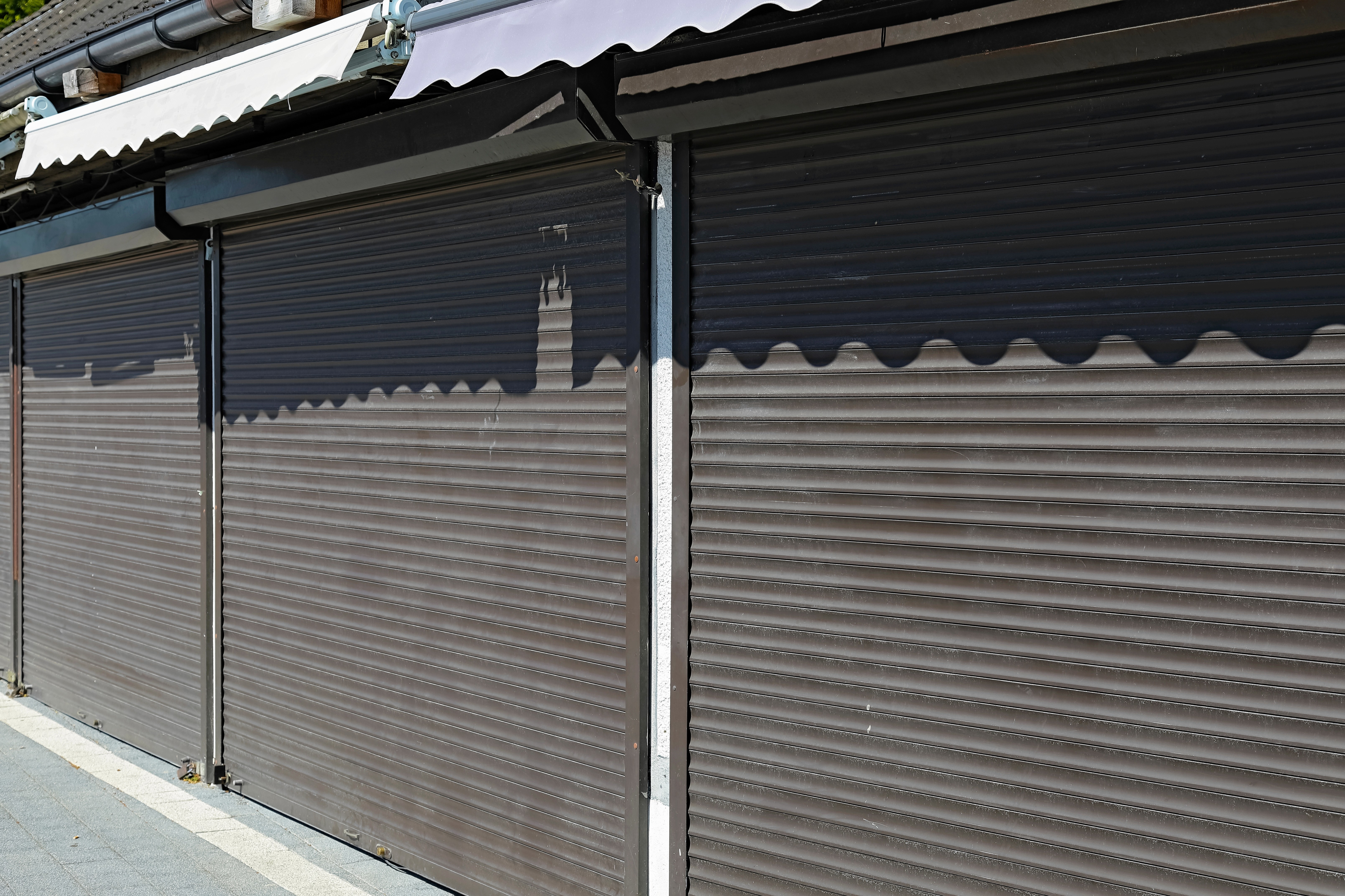 Heavy-duty roller shutter closed over a warehouse loading bay entrance.