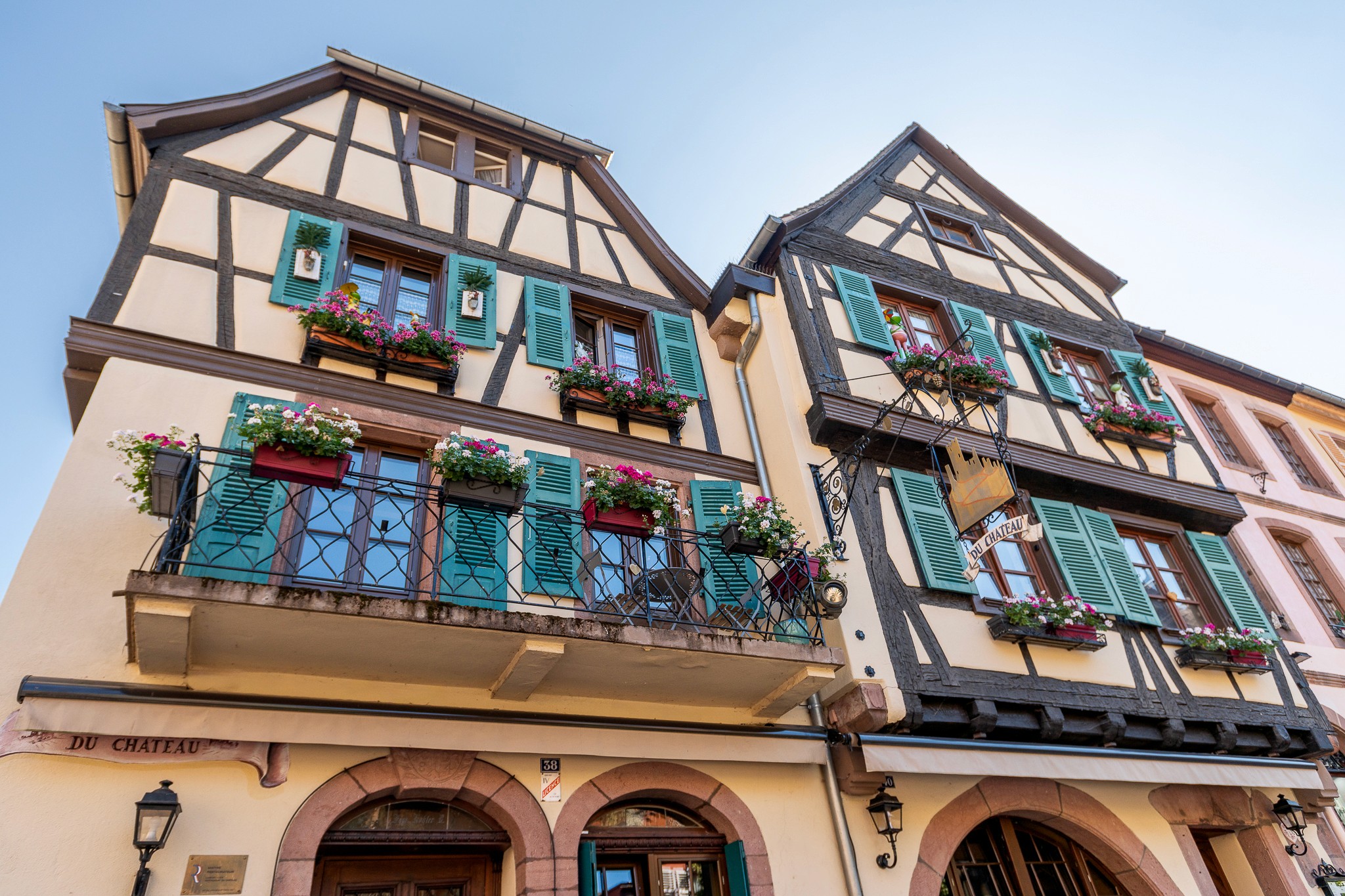 Restaurant exterior with black facade and welcoming atmosphere.