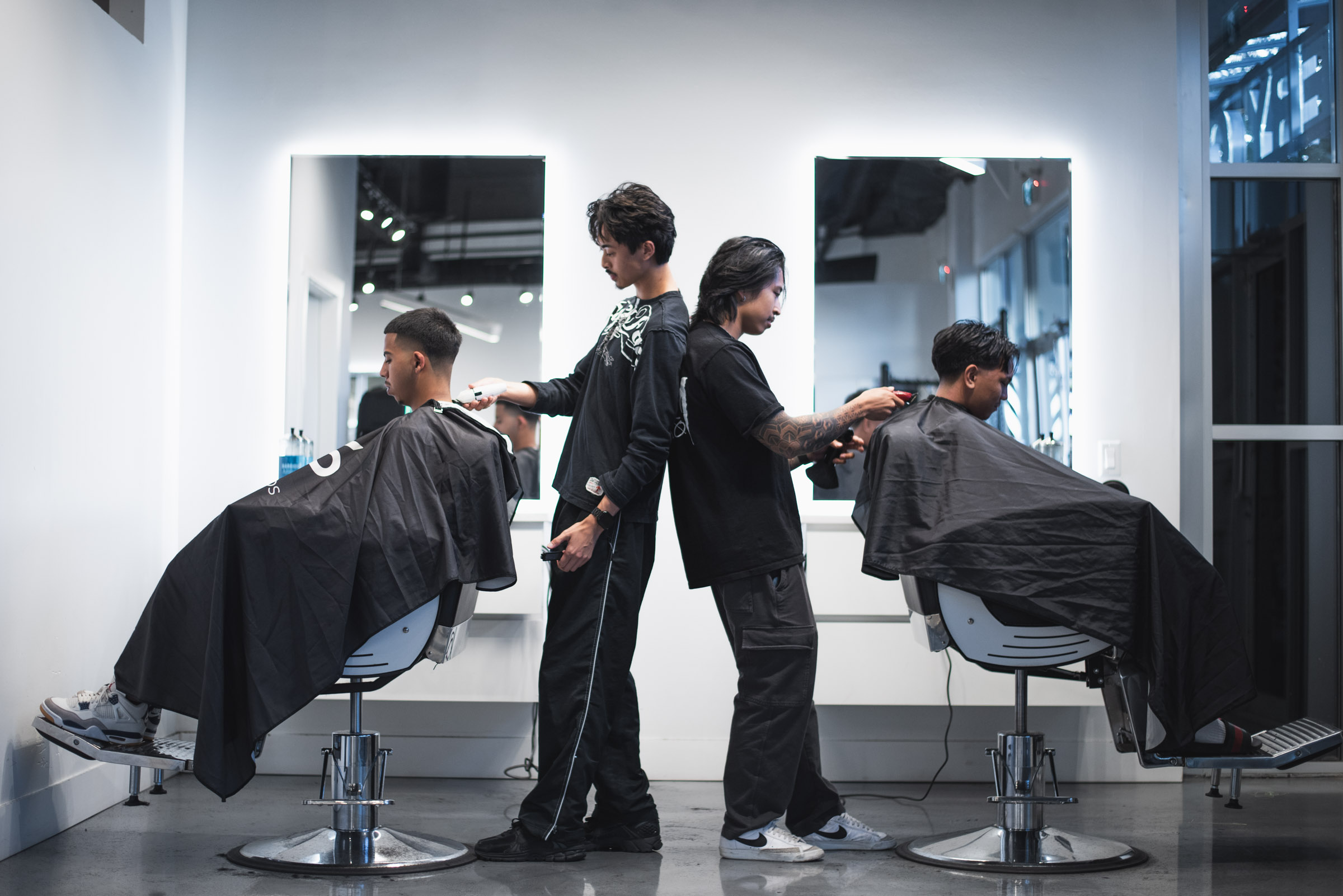 Man in a white cap and red shirt holding a golf club, looking focused against a clear blue sky.