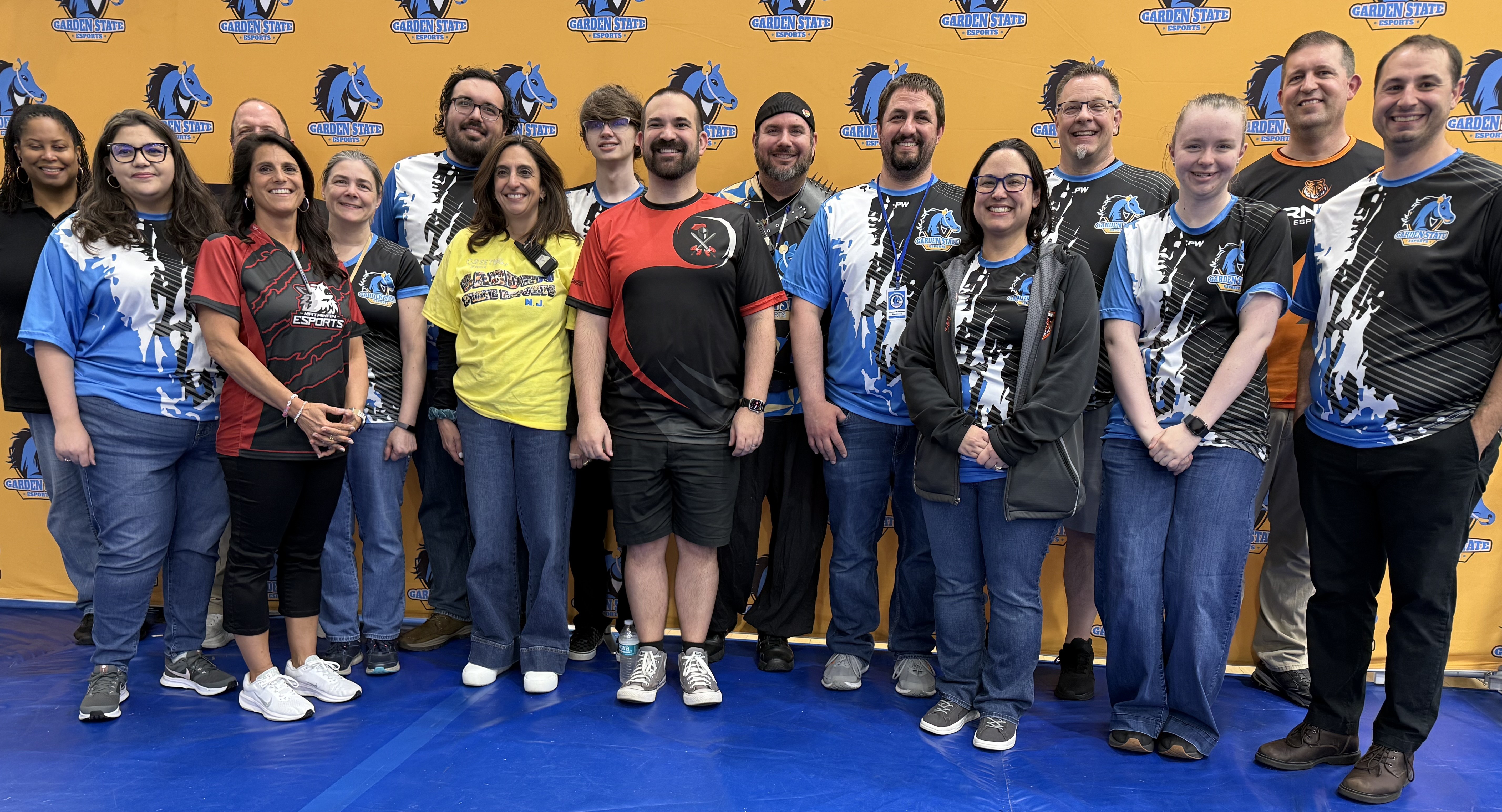 Garden State Esports staff and coaches together at a state championship