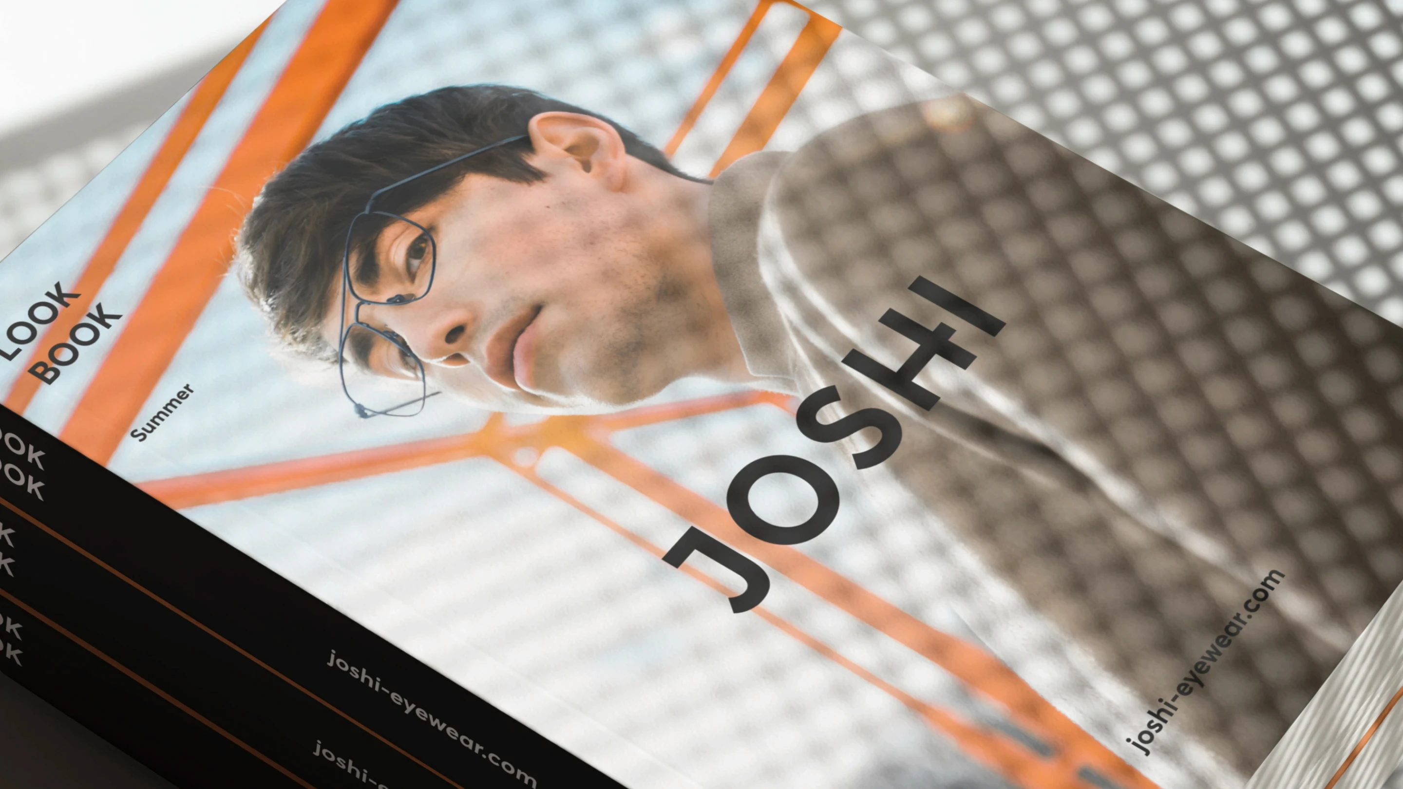 Magazine with cover of a man wearing glasses
