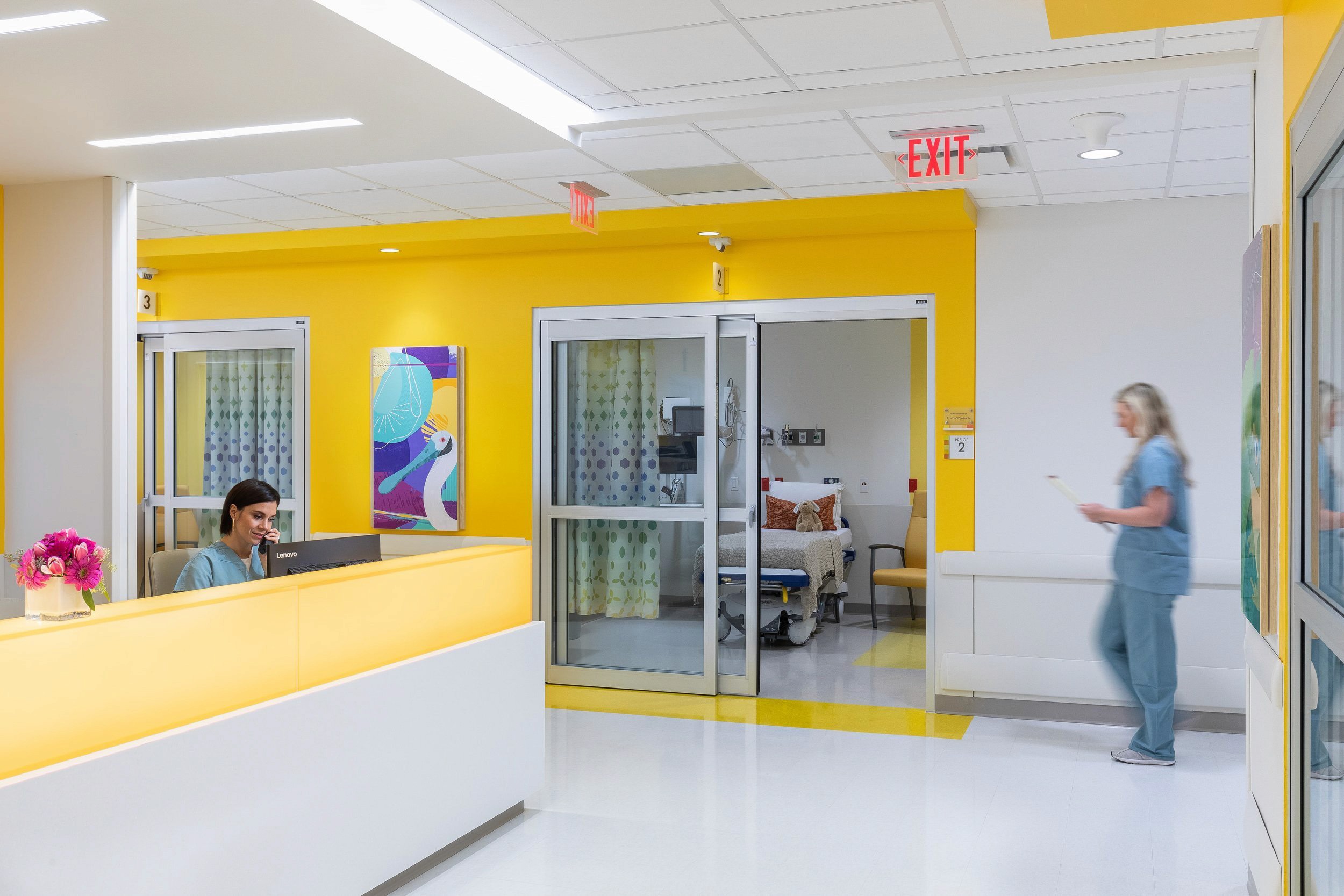 Hospital reception with nurse and patient room access.