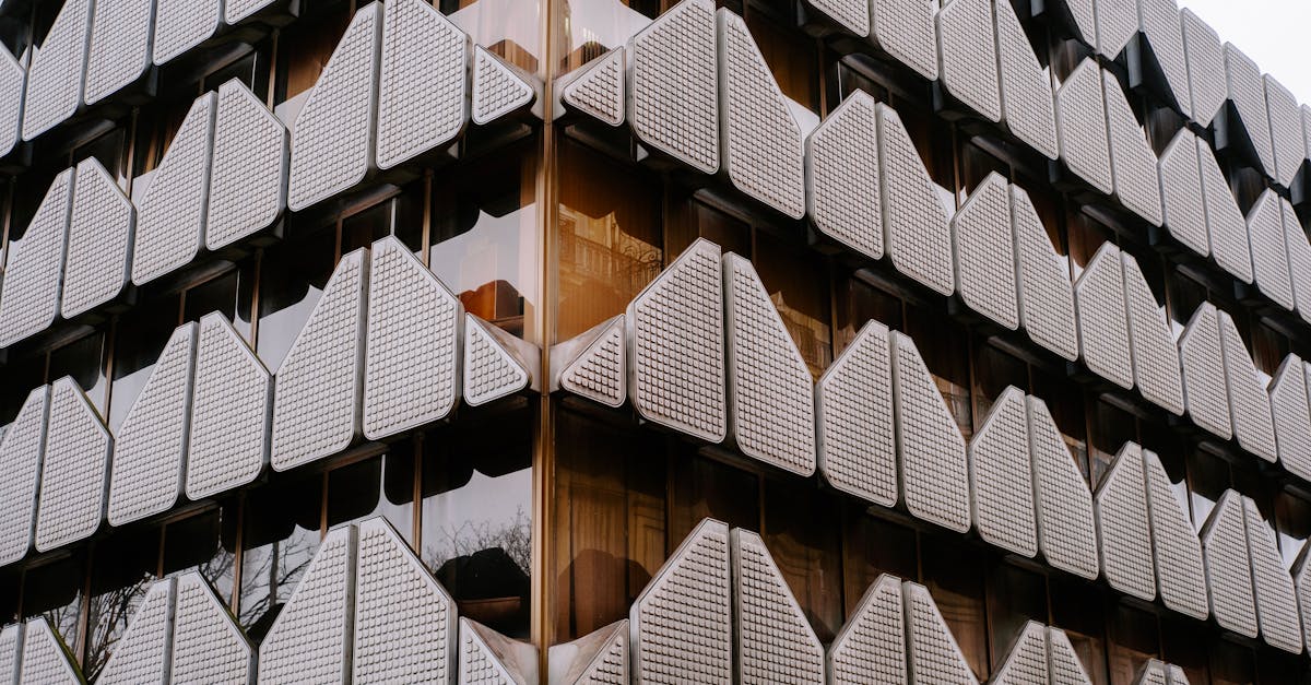 Intricate geometric facade of a modern building in Paris, France.