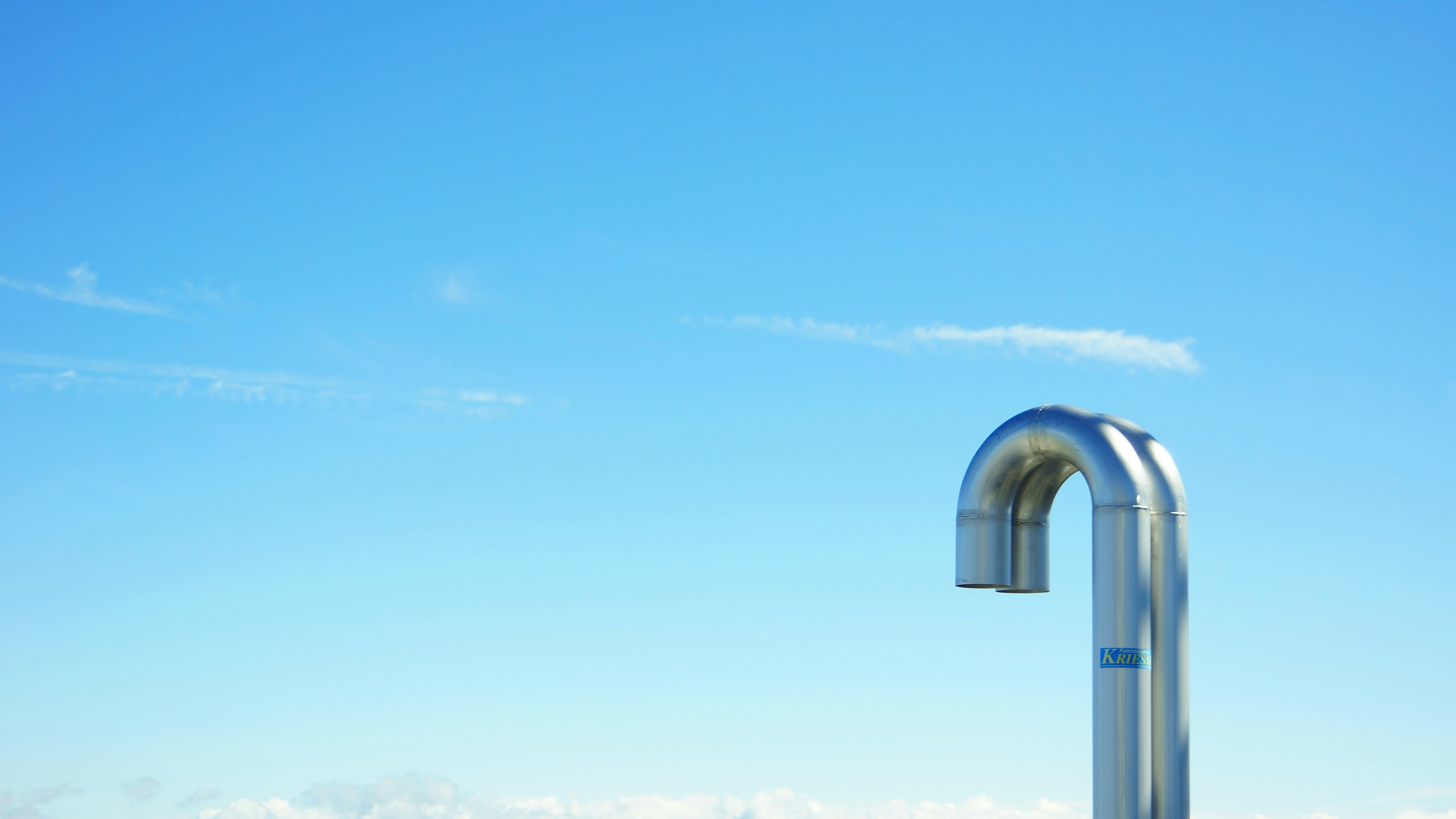 two gray pipes during daytime