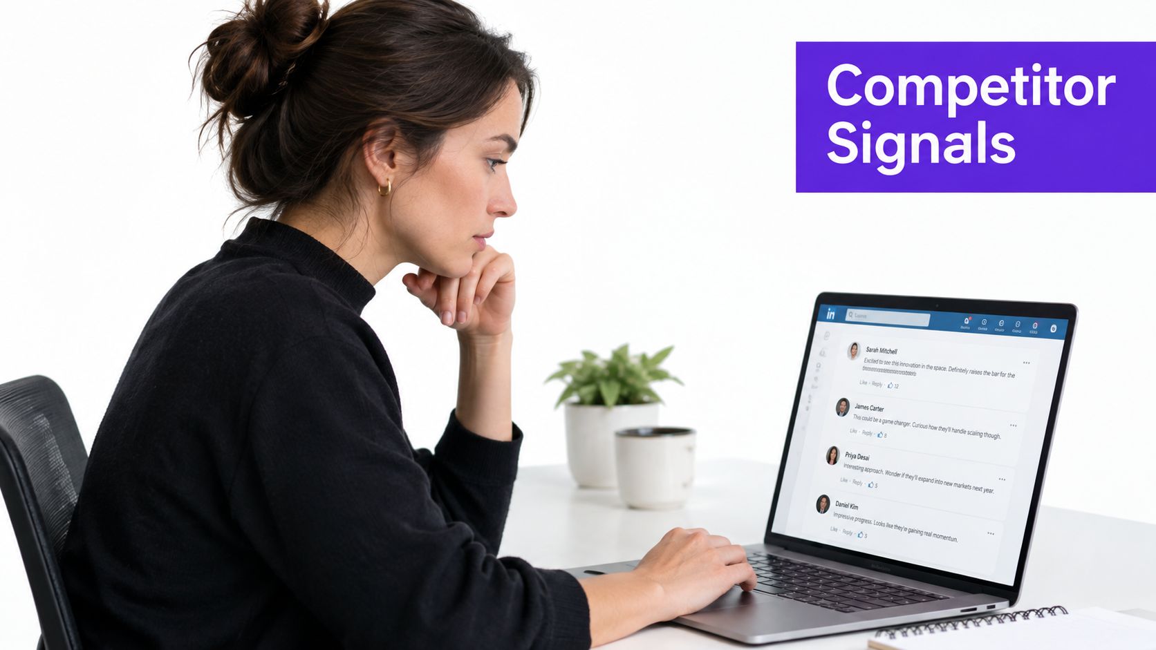 A professional woman sitting at a desk and reviewing competitor social media activity on her laptop computer.