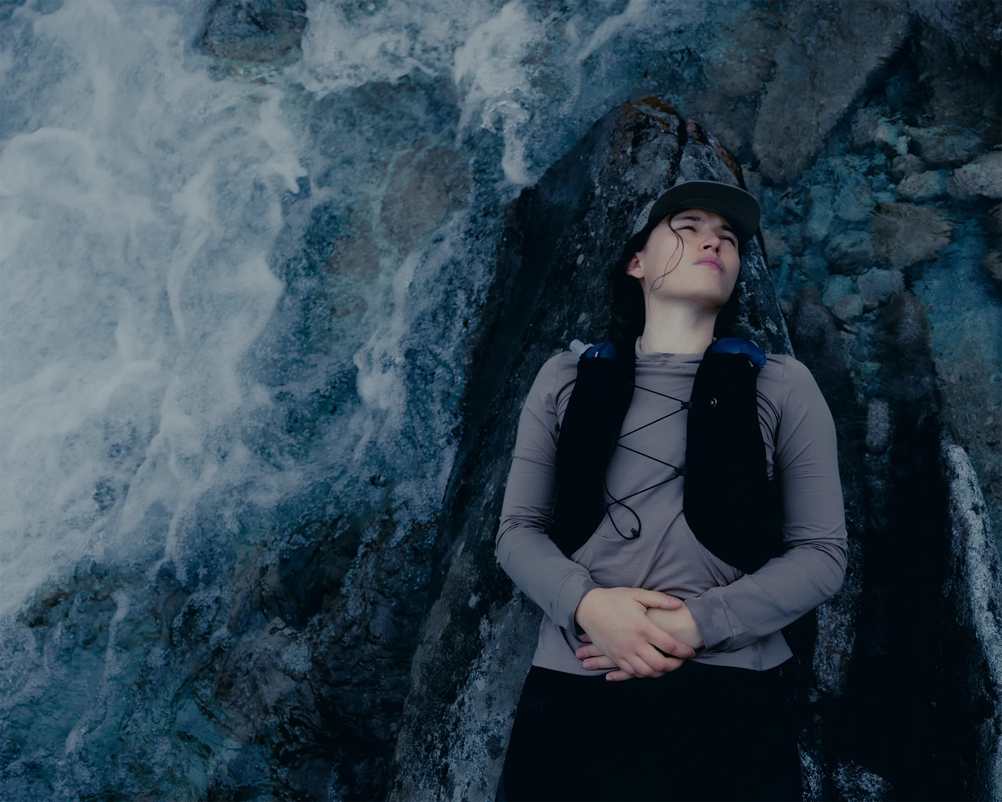 picture of woman trail running while resting in the ice.