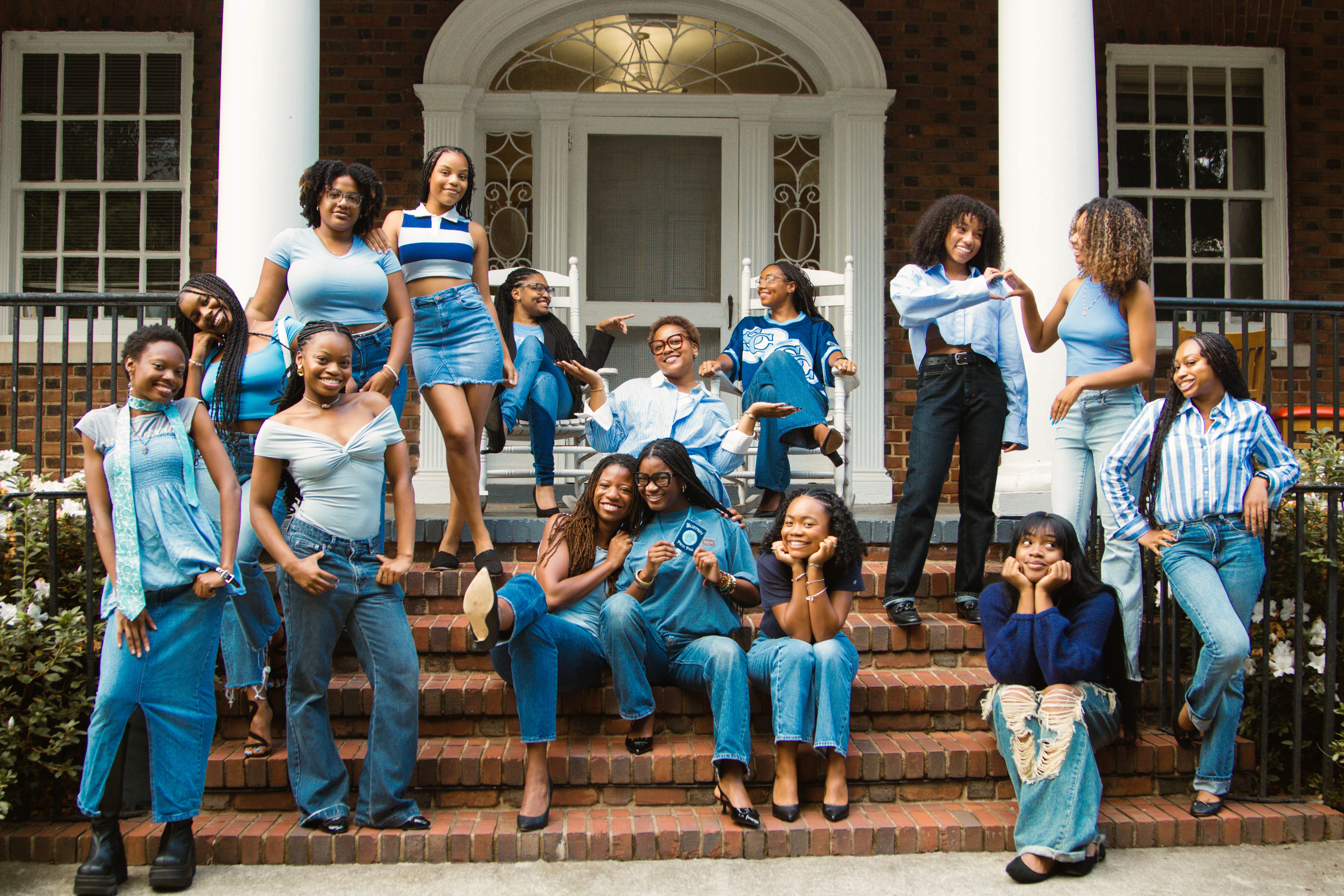 Tree branches reach towards a clear, blue sky.