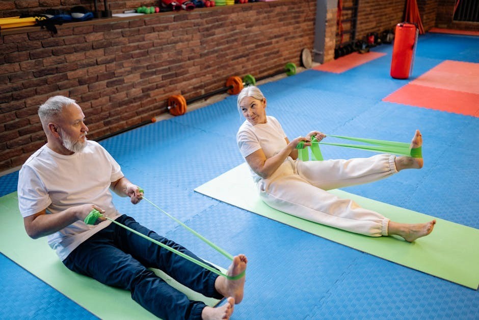 Older adults working out with resistance equipment under supervision.