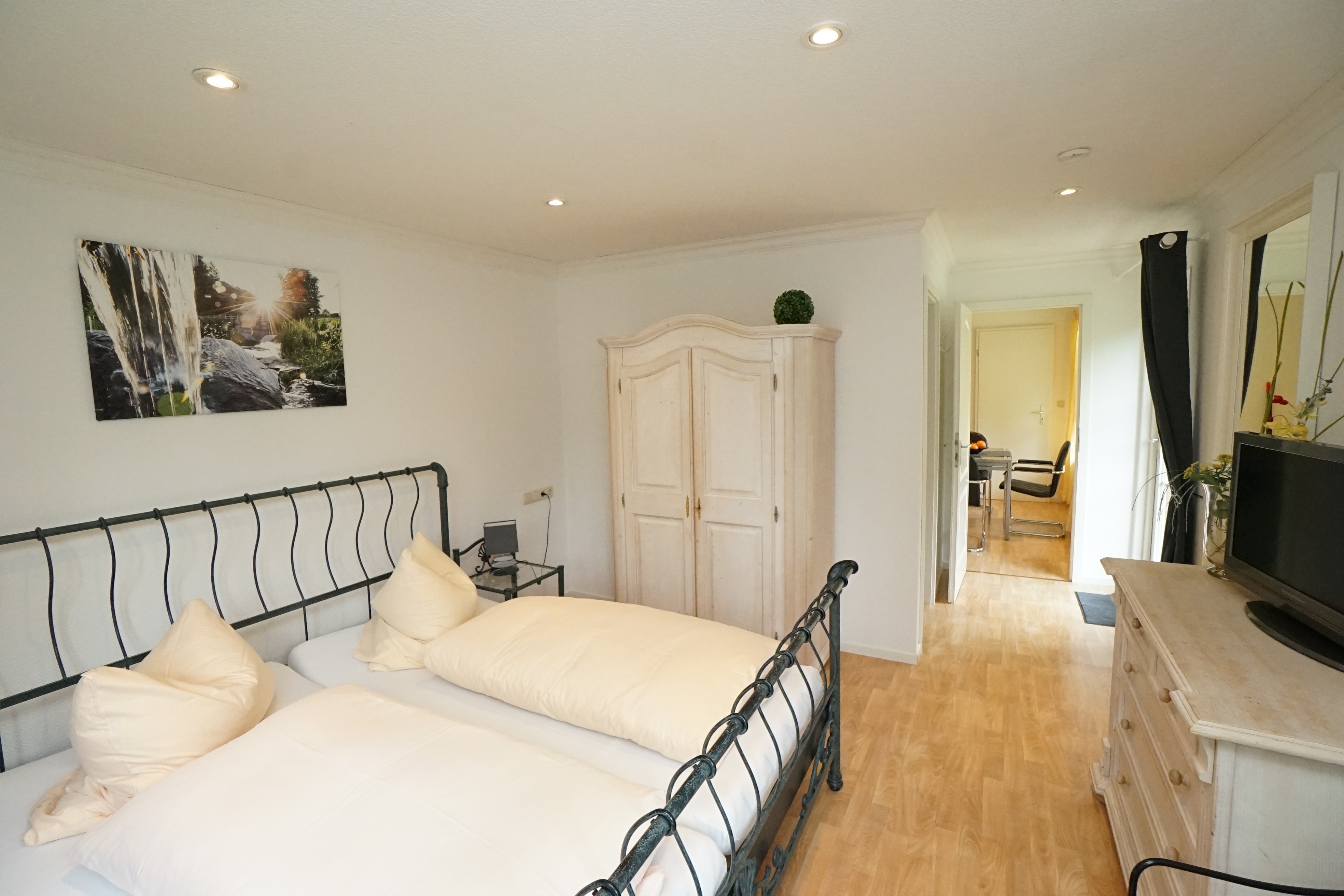 Room with double bed and wardrobe