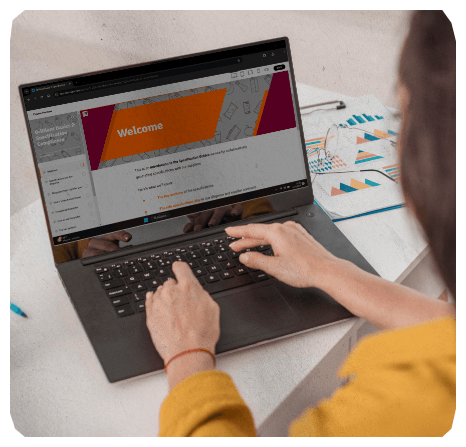 Female on her desk doing an bespoke e learning on her laptop