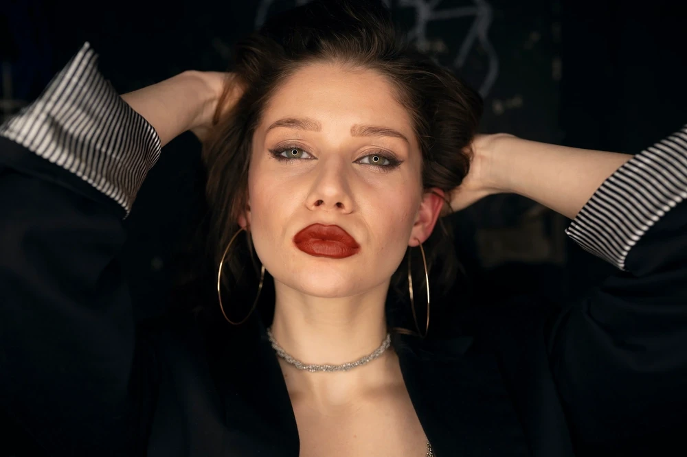 Model is checking her hair in a club bathroom