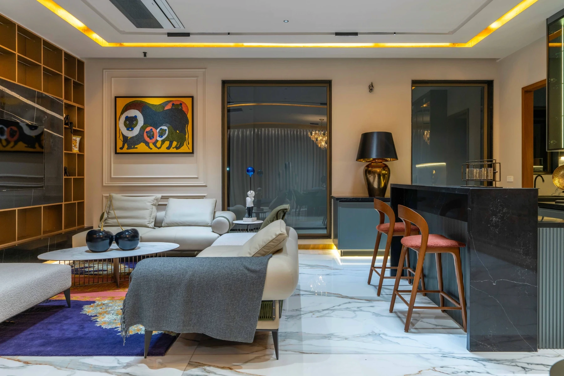 Luxury model home living room with double-height ceiling, marble feature wall and statement wall paintings