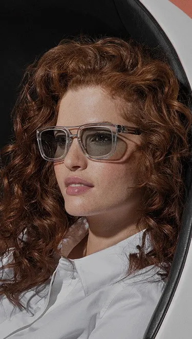 Women with ic! Berlin frame wearing Transitions XTRActive lenses