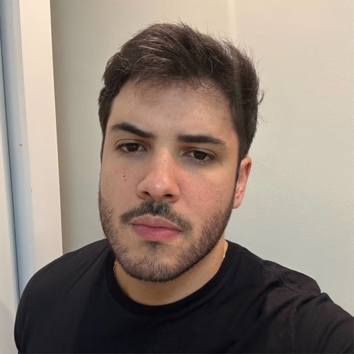 Black and white portrait of a man with a beard and glasses