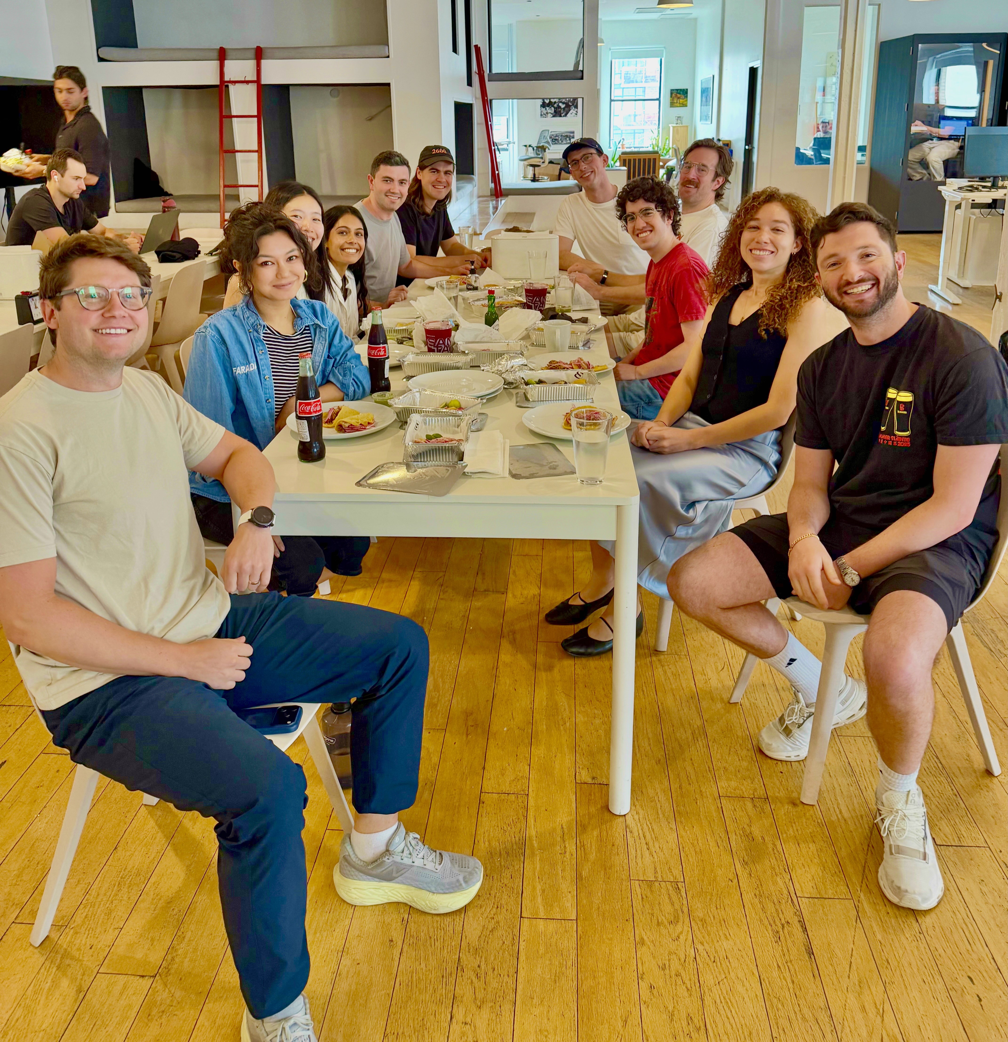 Faraday team gathered around a table