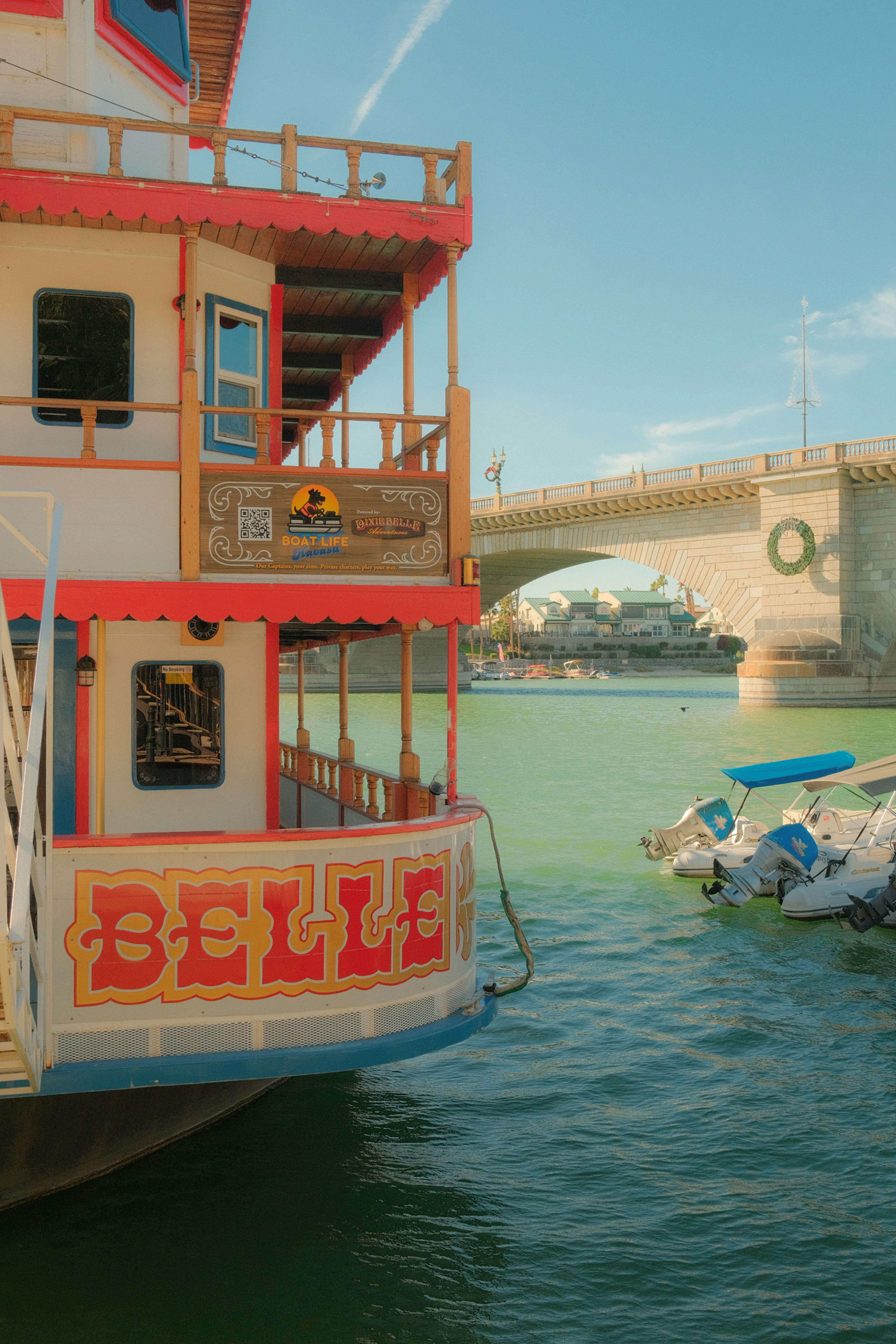 Paddlewheel boat named belle on the water