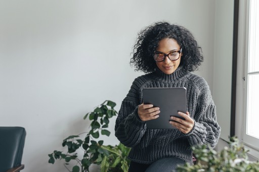 woman looking at a tablet