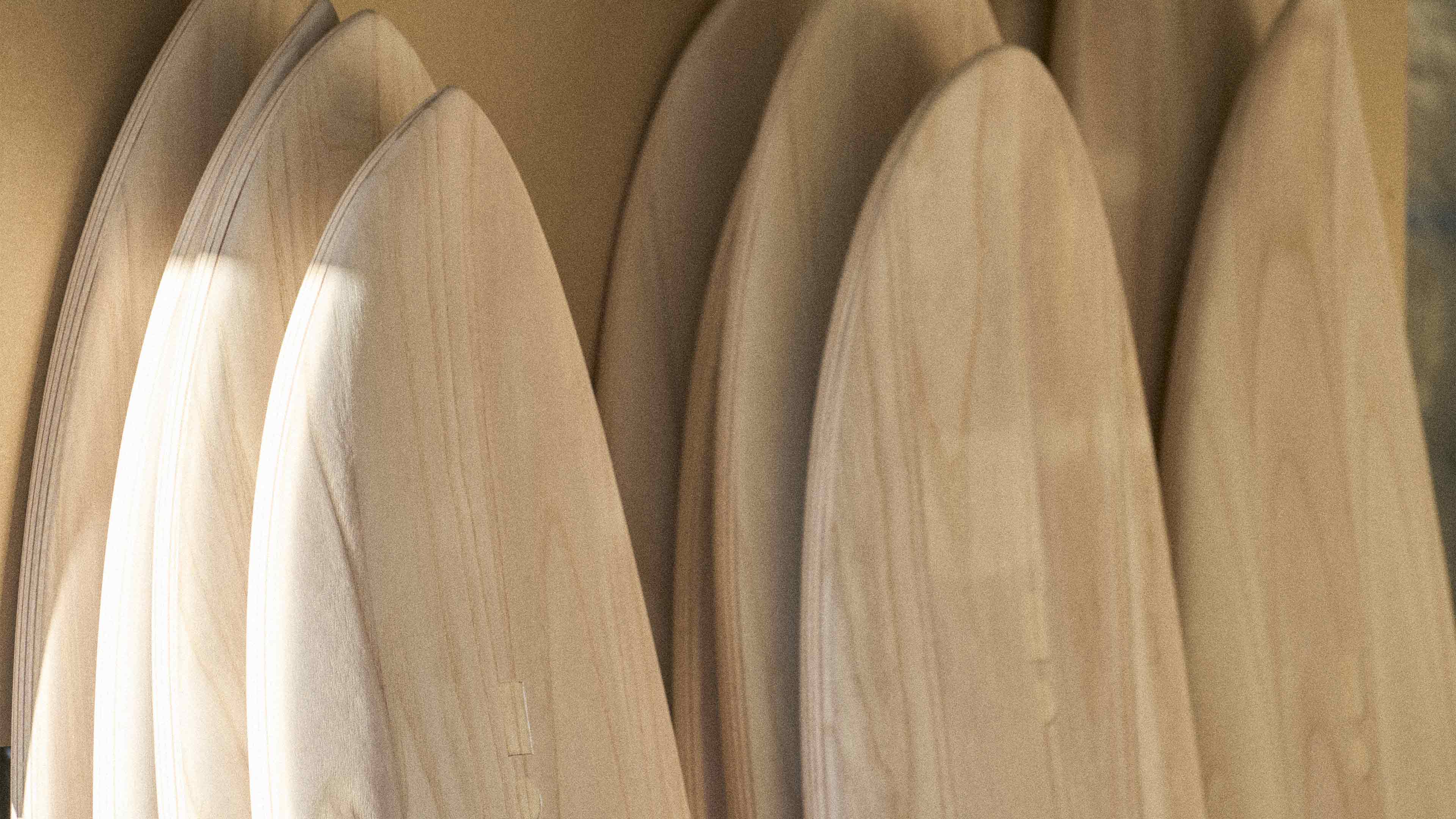 Stacks of wooden surfboard blanks