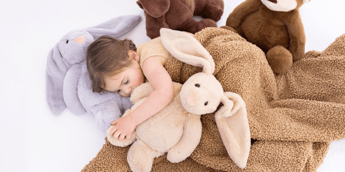 Founder Indre Ptak with her children, showcasing Olivia and Jack's sensory-friendly toys designed for emotional well-being and support.