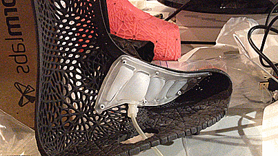 Black lattice SOLS ADAPTIV prototype fitted around a translucent internal shoe structure