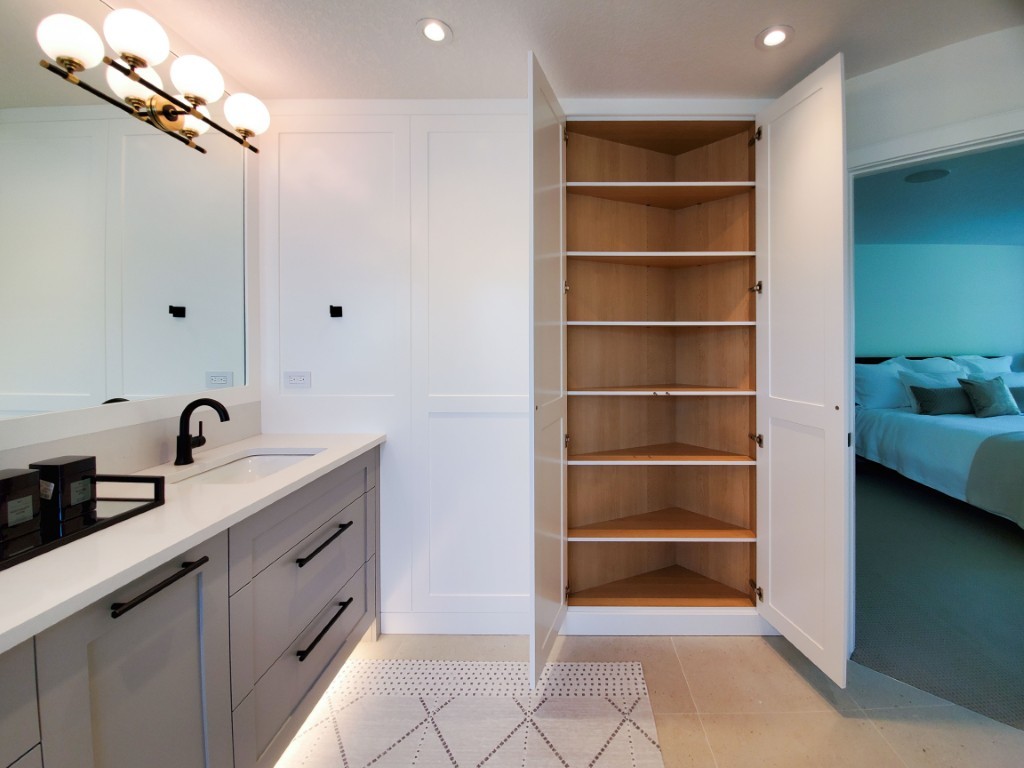 Image of KHD Homes luxury primary ensuite bathroom with custom cabinetry and spacious walk-in closet interior design.