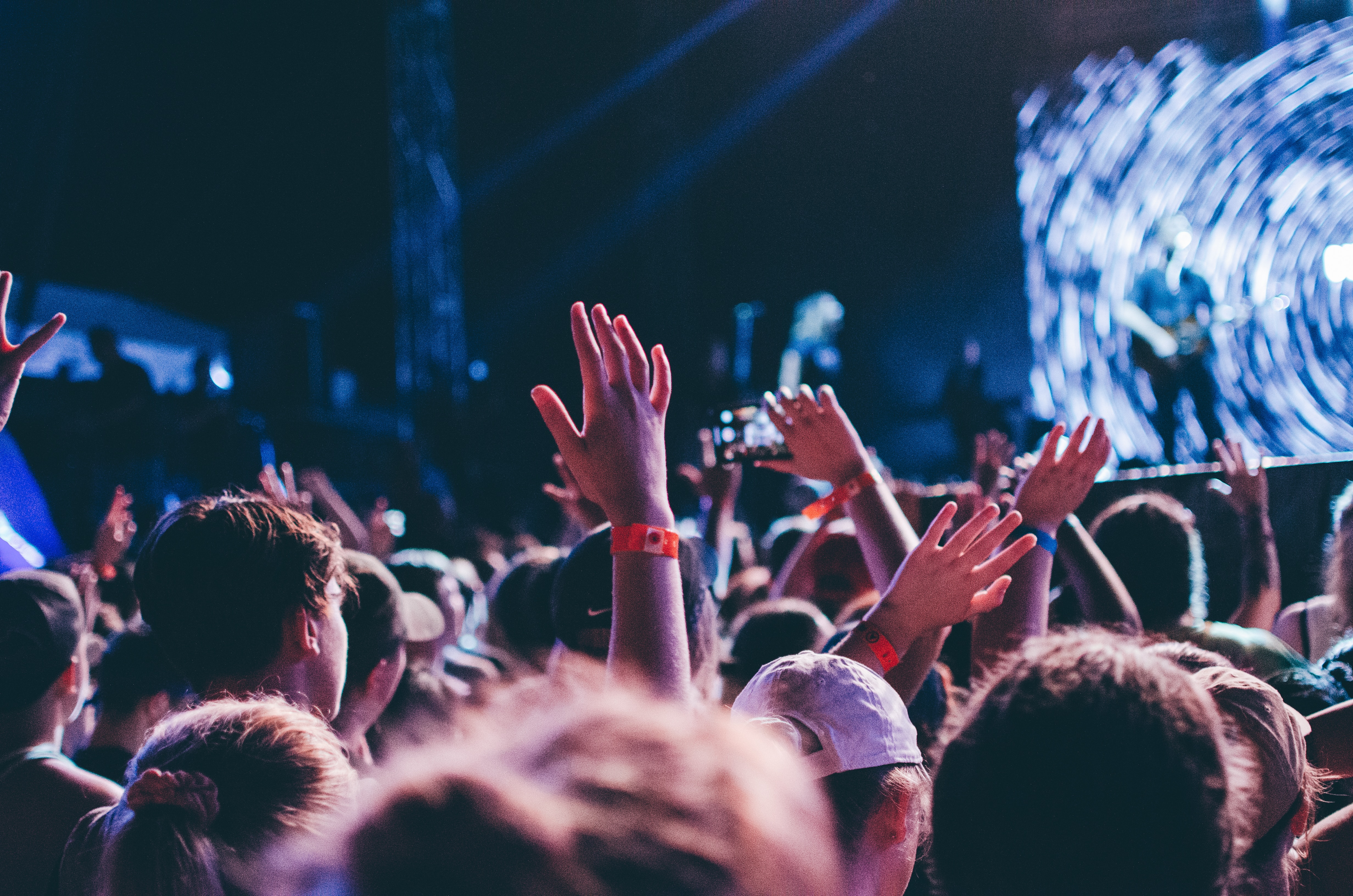 man in crowd enjoying song - how to write hit songs