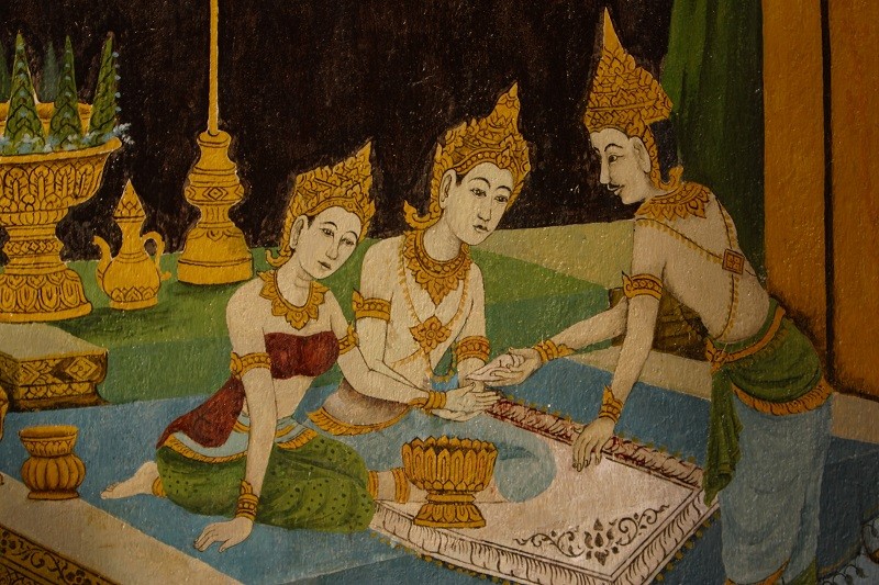 Close-up of vibrant purple flowers with droplets of water, creating a rich, textured background.