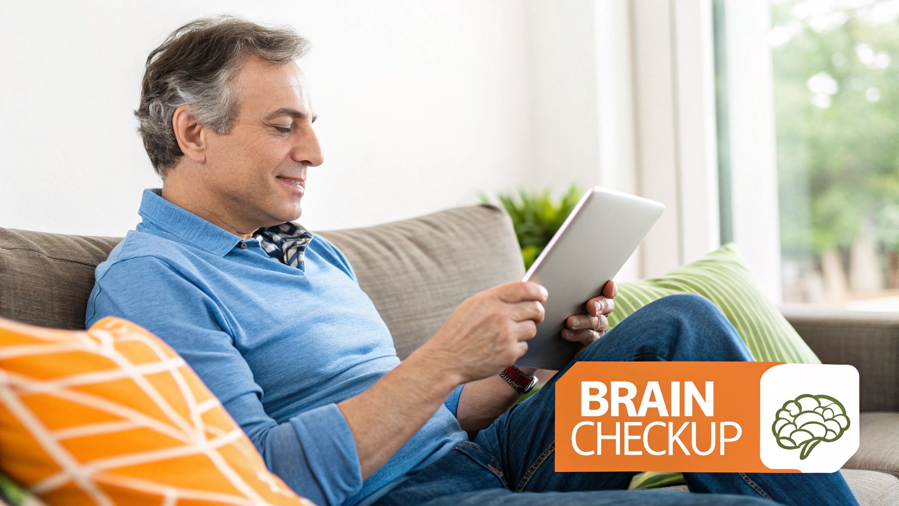 Middle-aged man relaxing on couch using tablet for brain checkup cognitive screening test online
