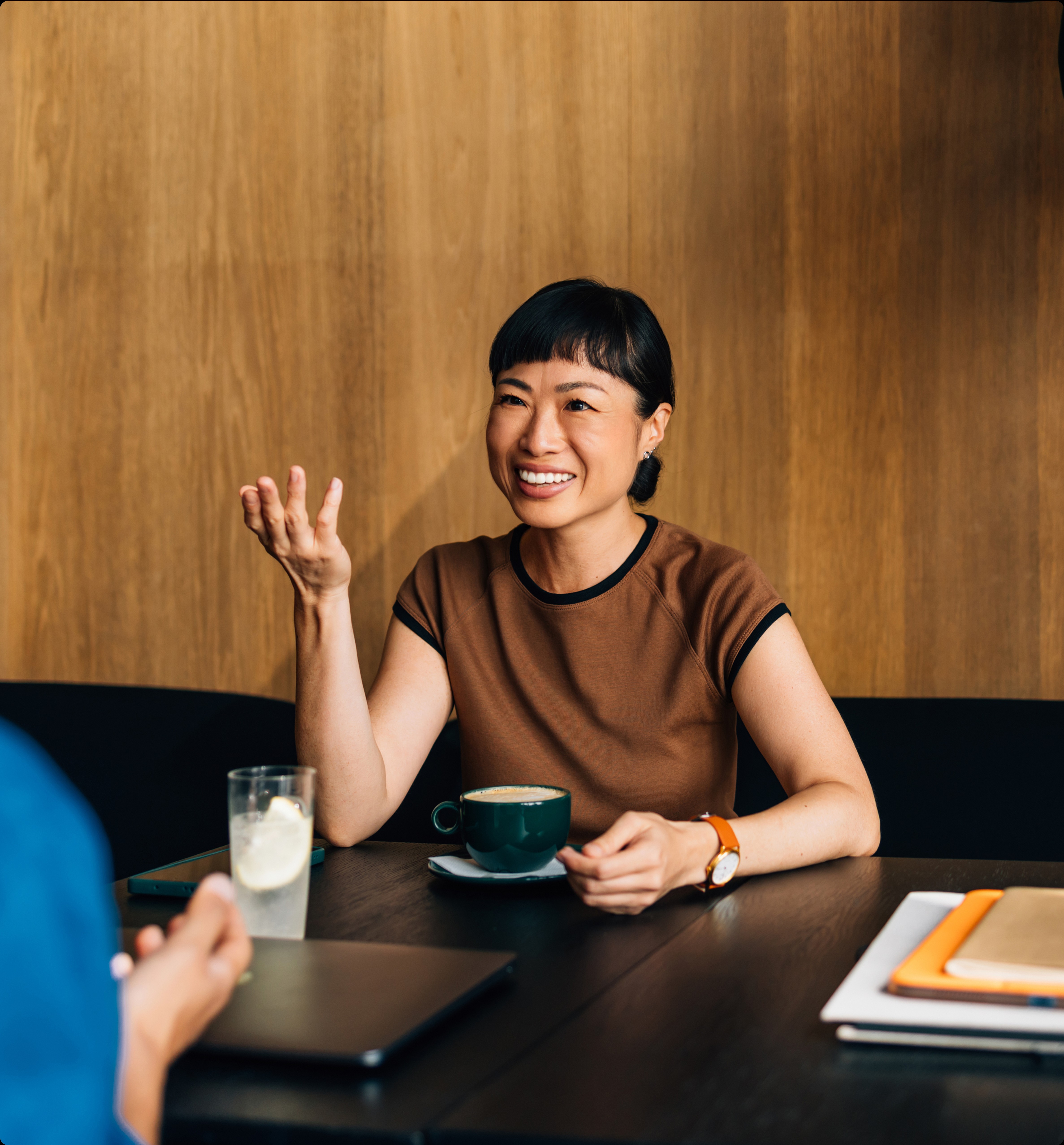 visa lawyer meeting with client over coffee